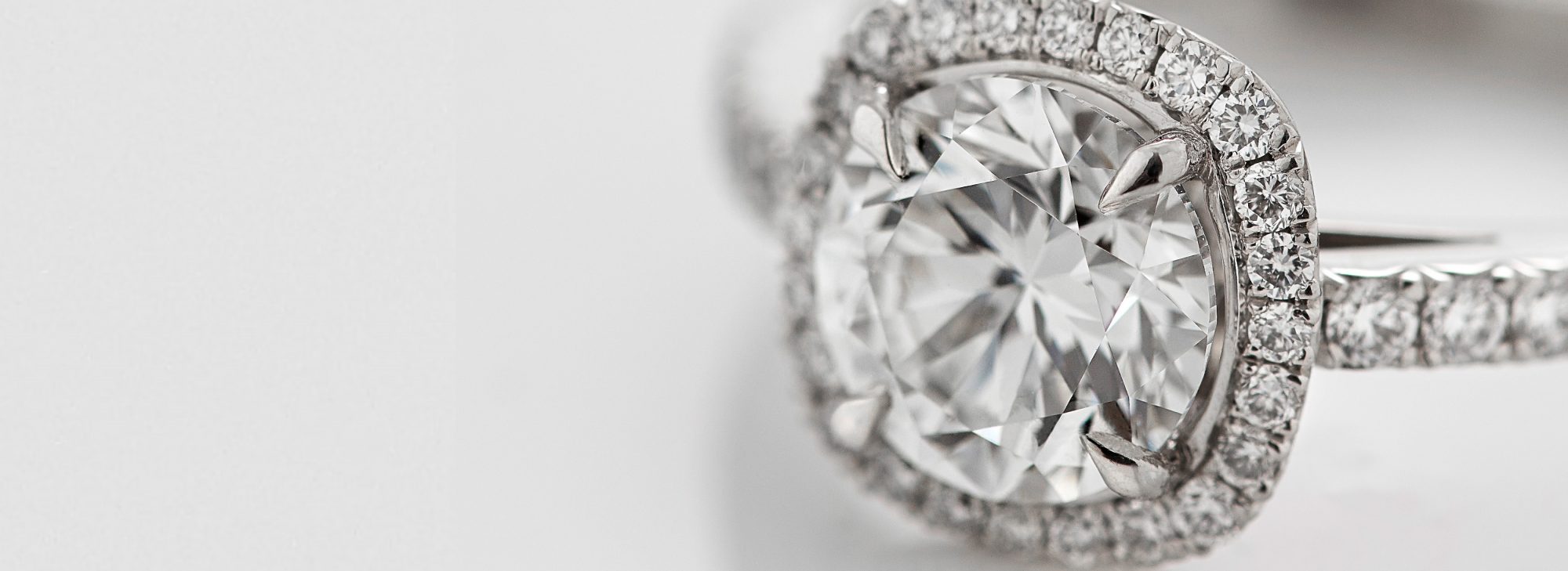 Close up side view of a Garrard bridal jewellery collection round diamond engagement ring