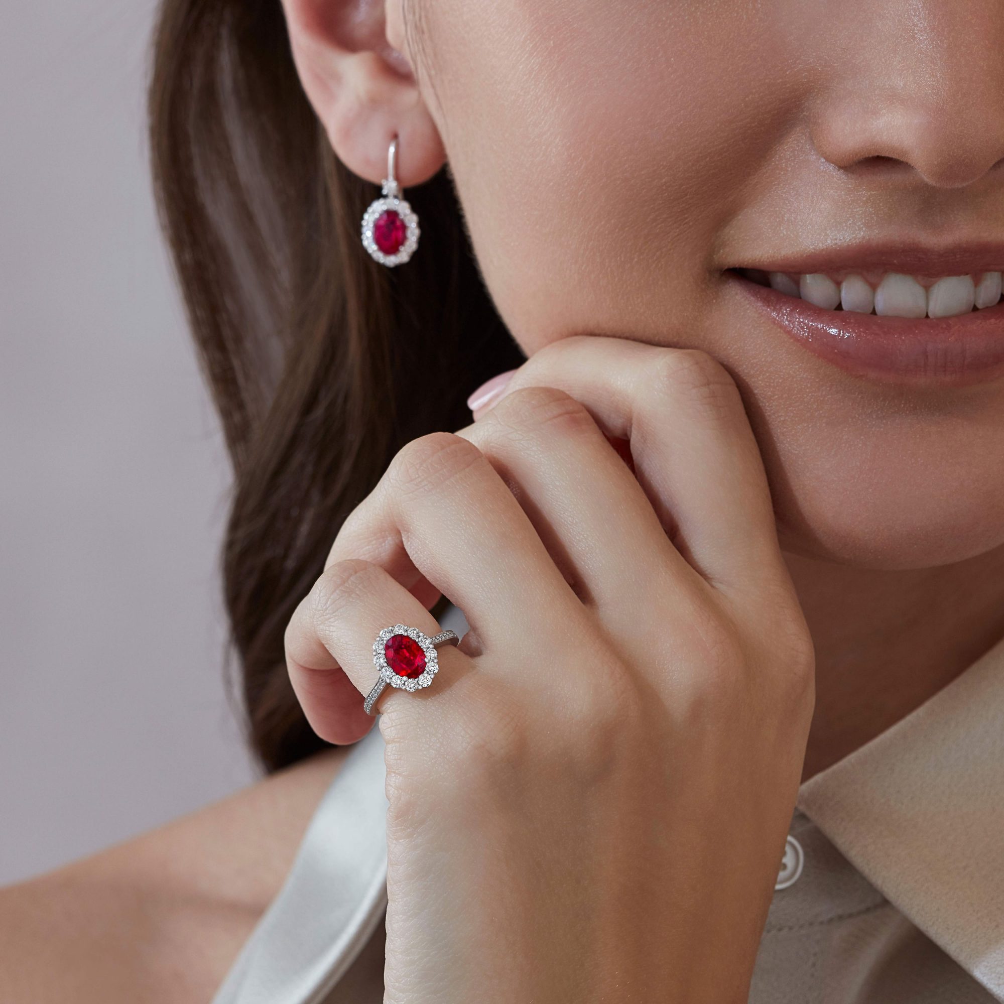 Model wears Garrard 1735 jewellery collection ruby and diamond earrings and ring