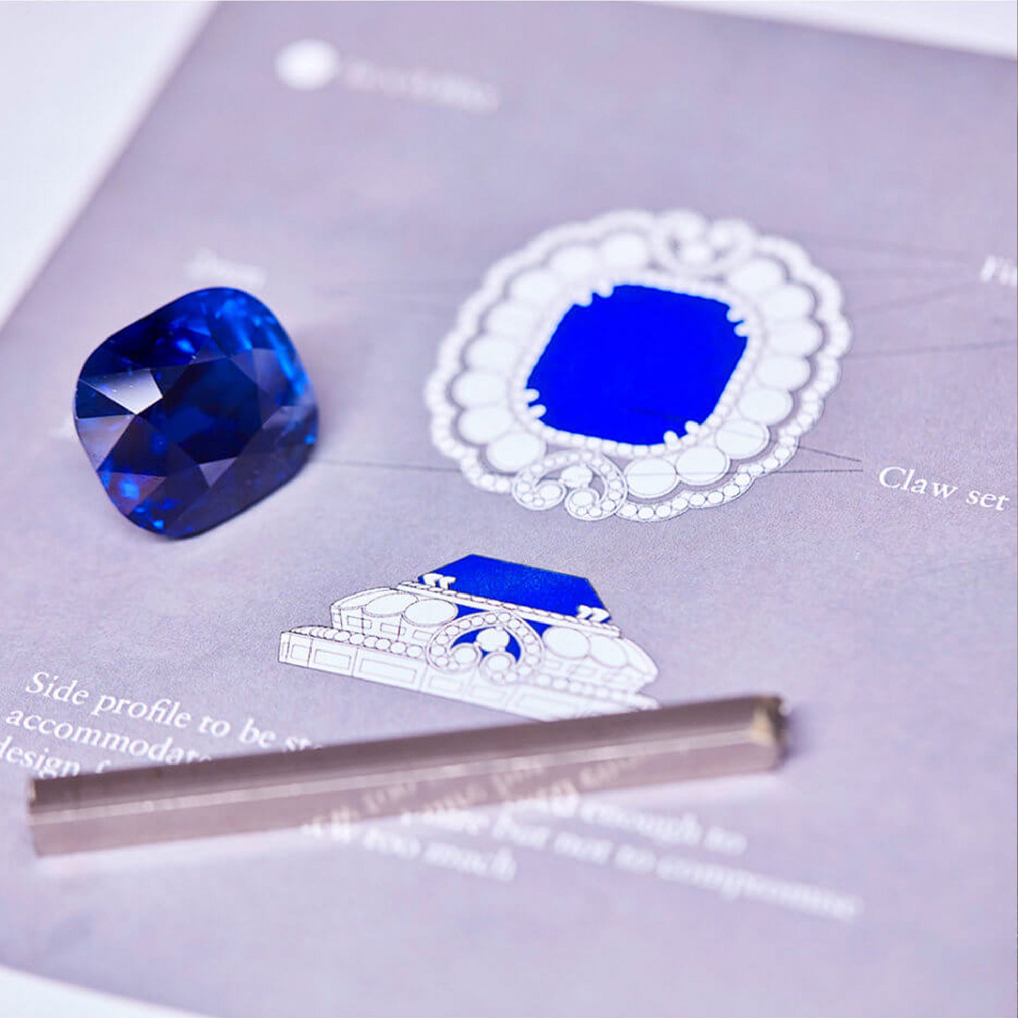 Close up of the 118.88ct Garrard Jubilee Sapphire on the deisgn certificate