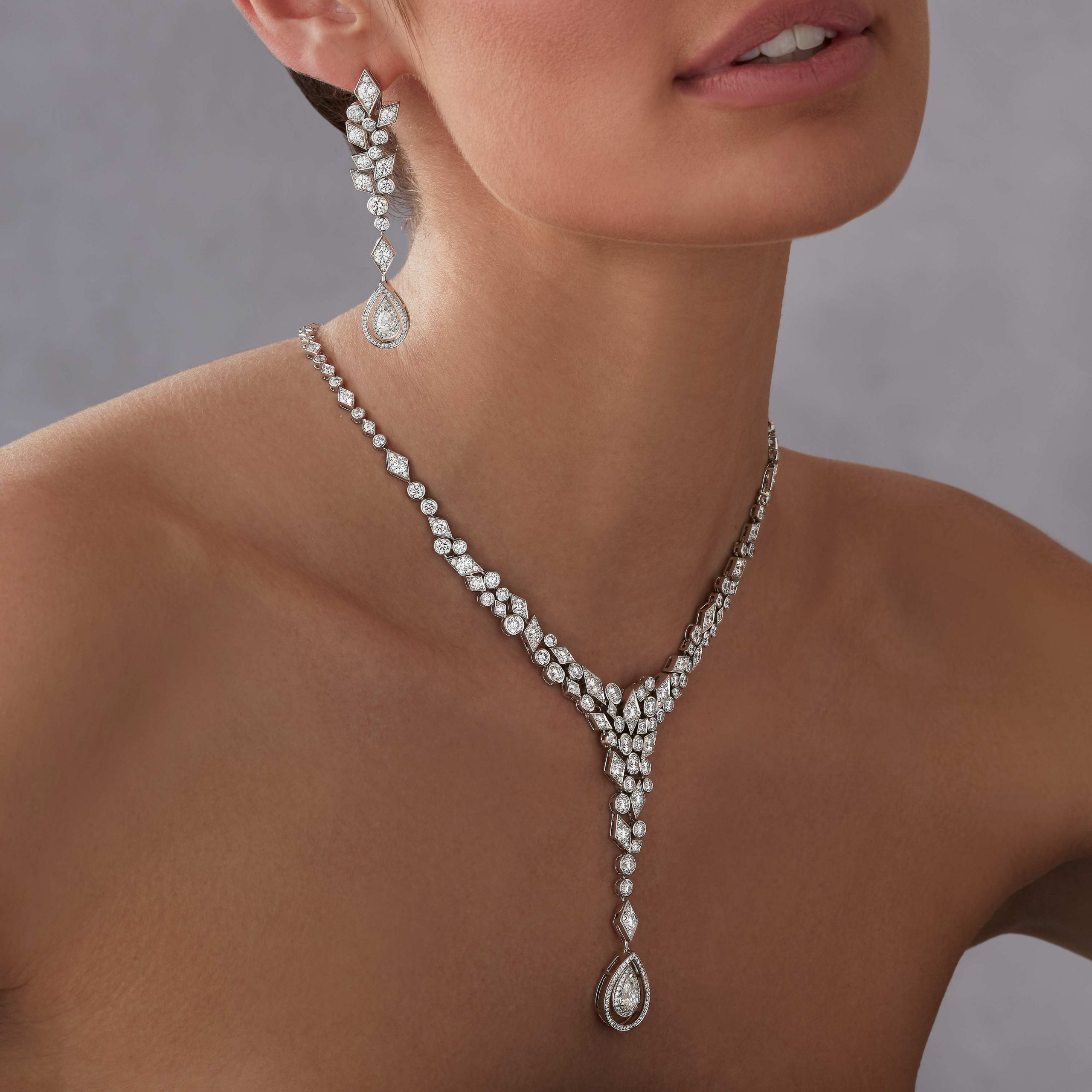Garrard Albemarle Abstract Convertible High Jewellery Diamond Drop Necklace In 18ct White Gold 2016681 and earrings 2016682 on model Garrard Albemarle Abstract Convertible High Jewellery Diamond Drop Necklace In 18ct White Gold 2016681 and earrings 2016682 on model