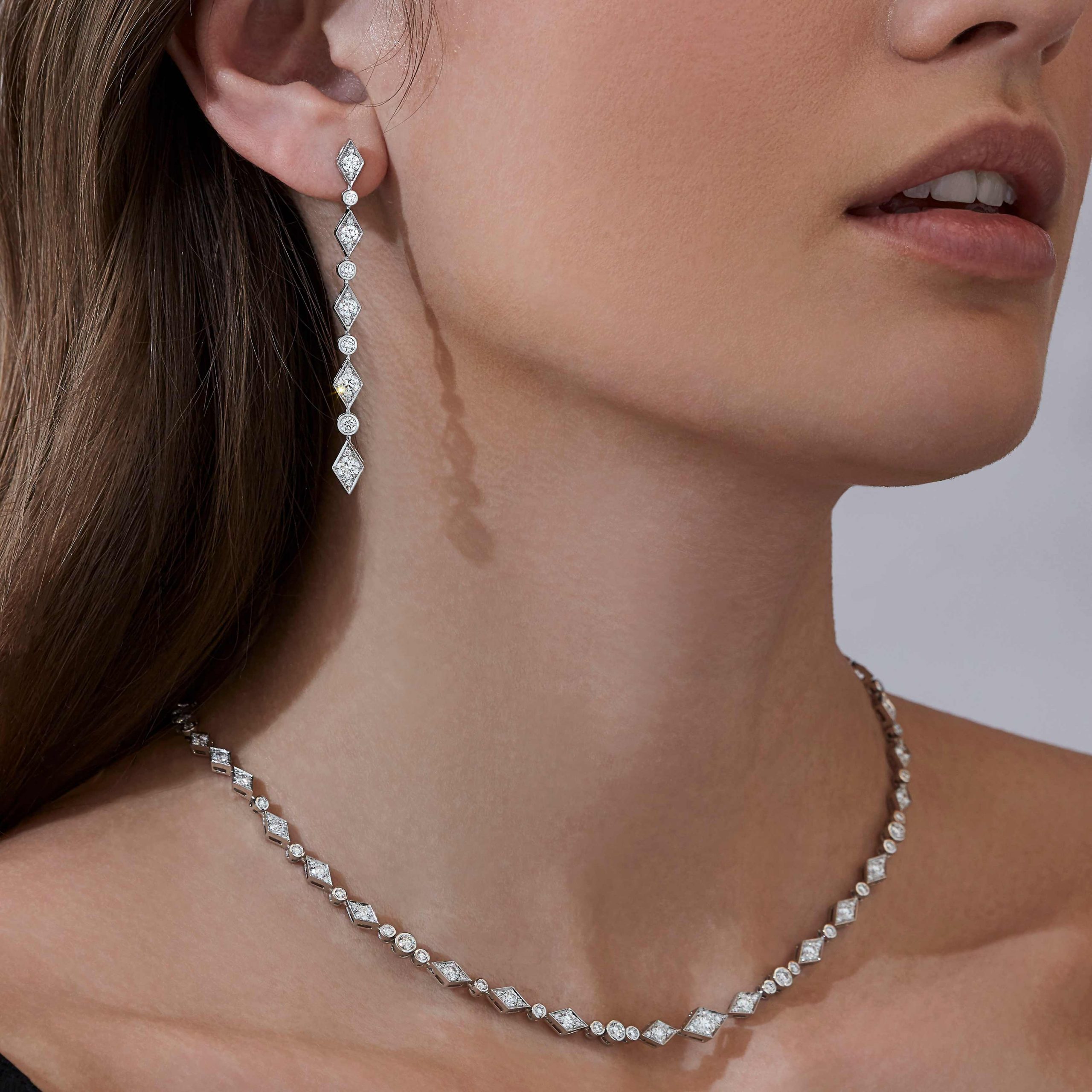 Garrard Albemarle jewellery collection Diamond Drop Earrings in 18ct White Gold 2014501 and necklace 2014503 On Model Garrard Albemarle jewellery collection Diamond Drop Earrings in 18ct White Gold 2014501 and necklace 2014503 On Model
