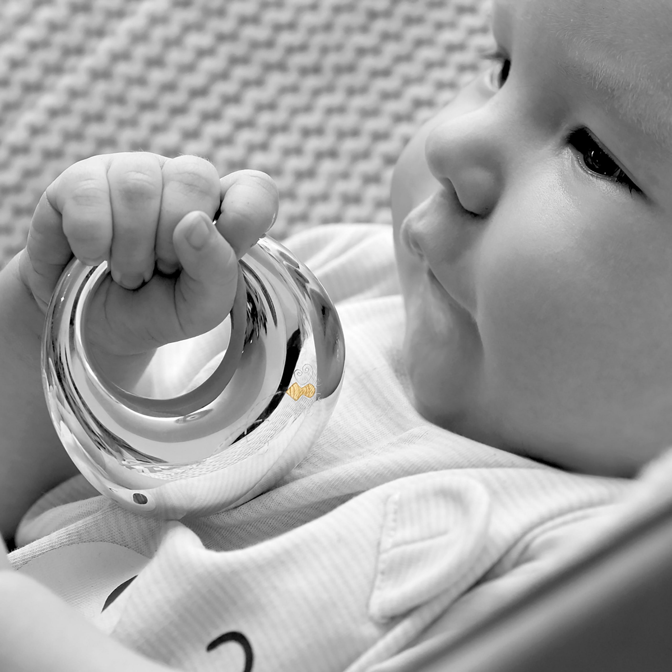 Garrard Christening New Baby Gift Baby Bee collection Sterling Silver Rattle 2017565held by a Baby Garrard Christening New Baby Gift Baby Bee collection Sterling Silver Rattle 2017565held by a Baby