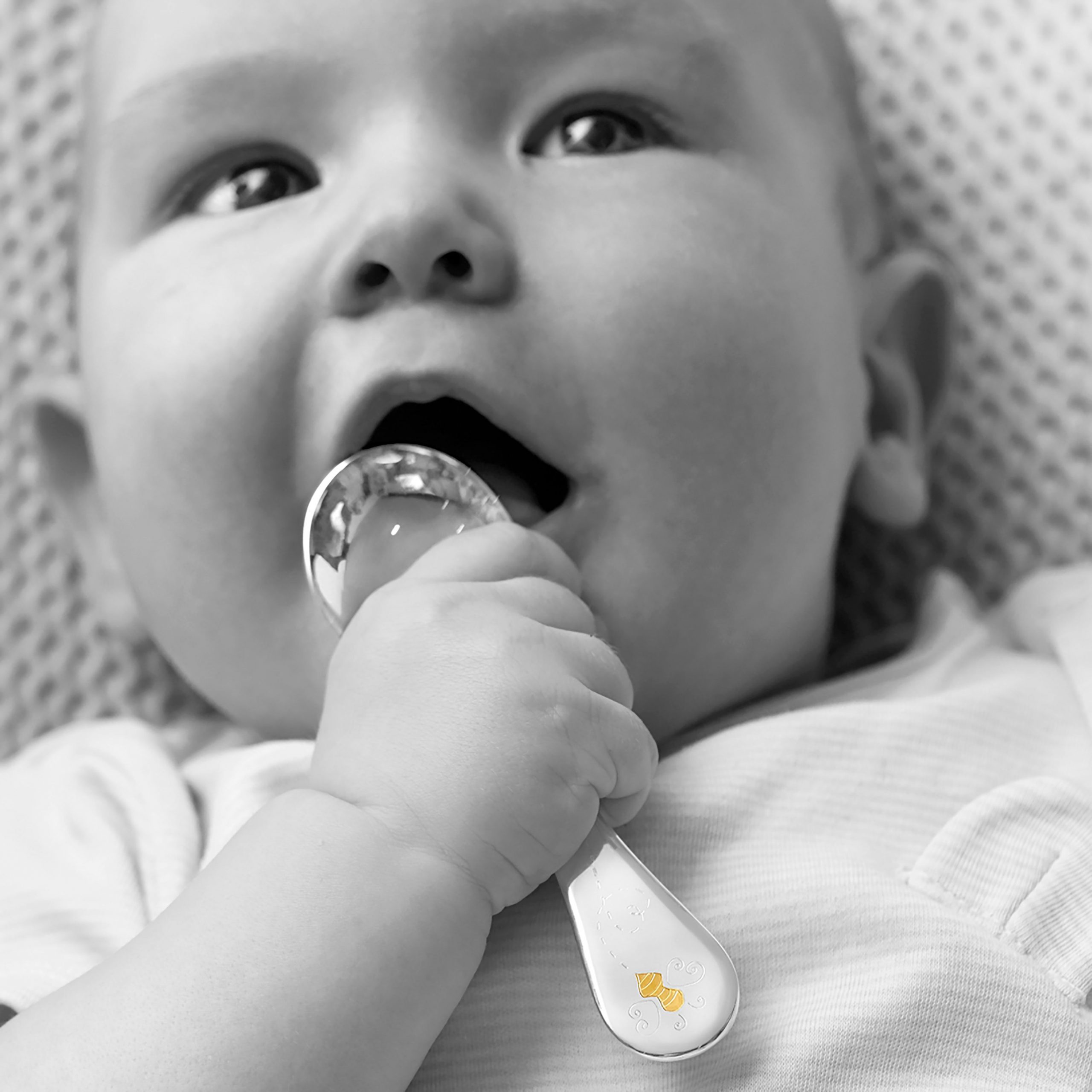 Garrard Christening New Baby Gift Baby Bee collection Sterling Silver Spoon 2017797 held by a Baby Garrard Christening New Baby Gift Baby Bee collection Sterling Silver Spoon 2017797 held by a Baby