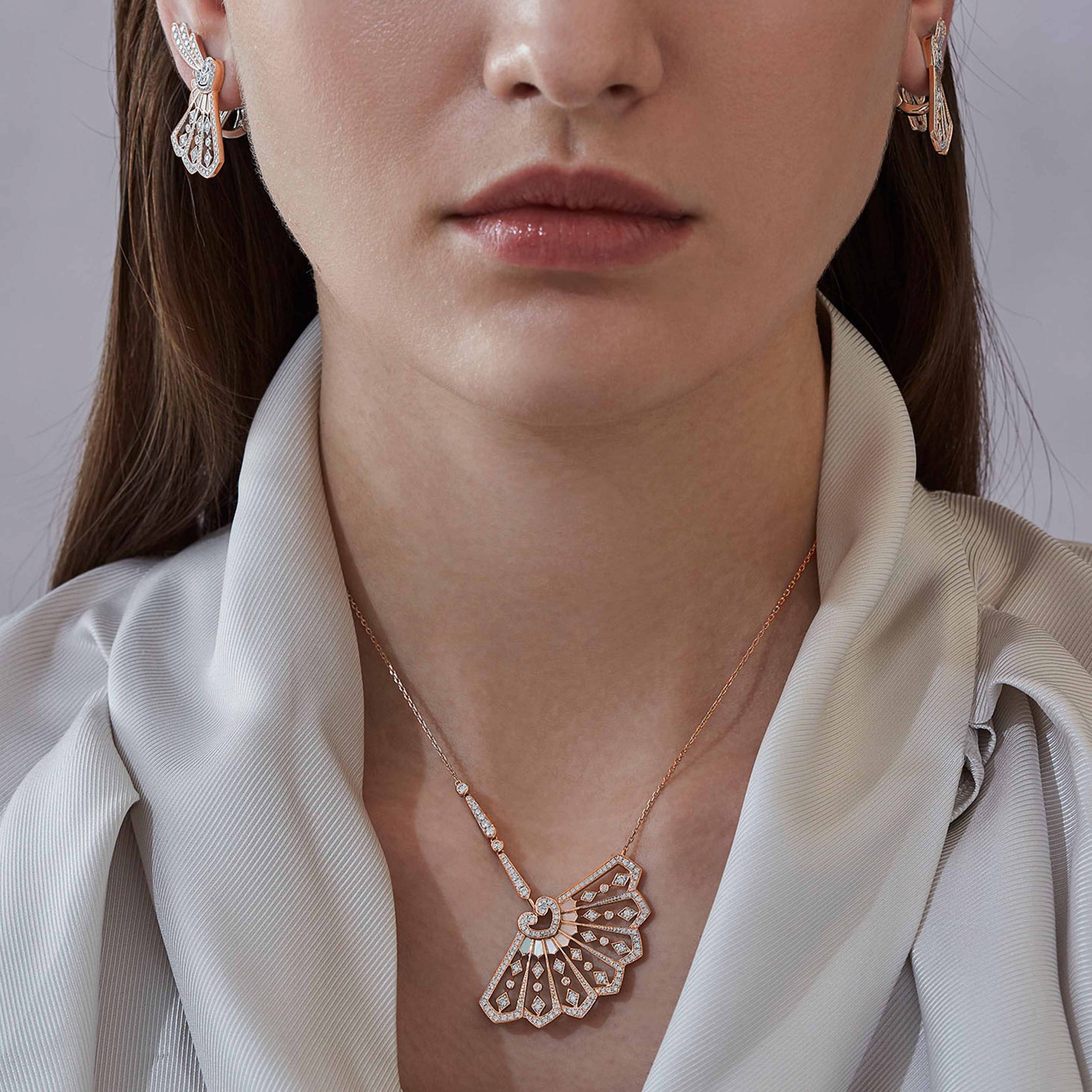 Garrard Fanfare Classic jewellery collection white diamond and mother of pearl pendant in 18ct rose gold 2015510 and earrings On Model Garrard Fanfare Classic jewellery collection white diamond and mother of pearl pendant in 18ct rose gold 2015510 and earrings On Model