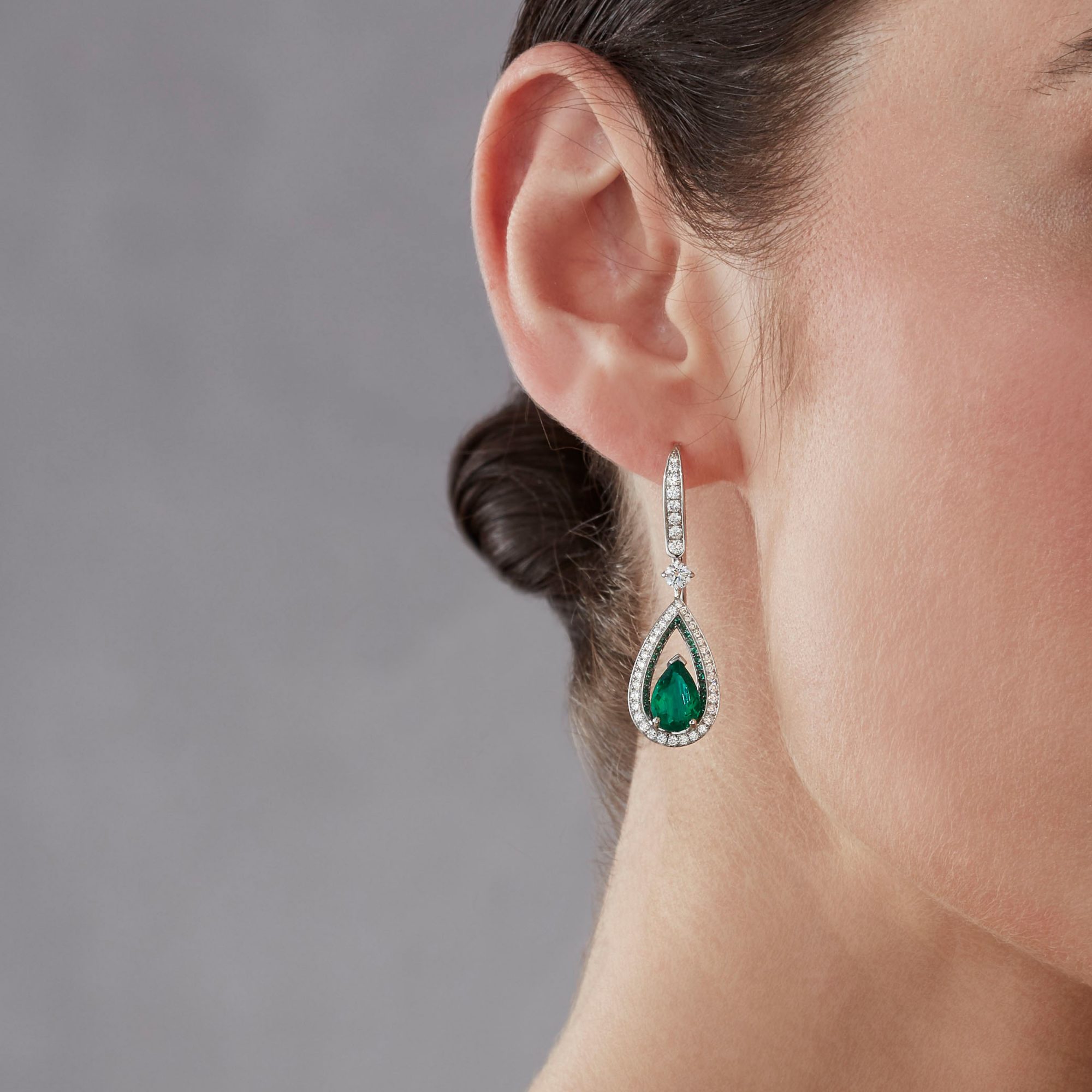Garrard Jewelled Vault Emerald and Diamond High Jewellery Drop Earrings In 18 Carat White Gold 2017381 on model