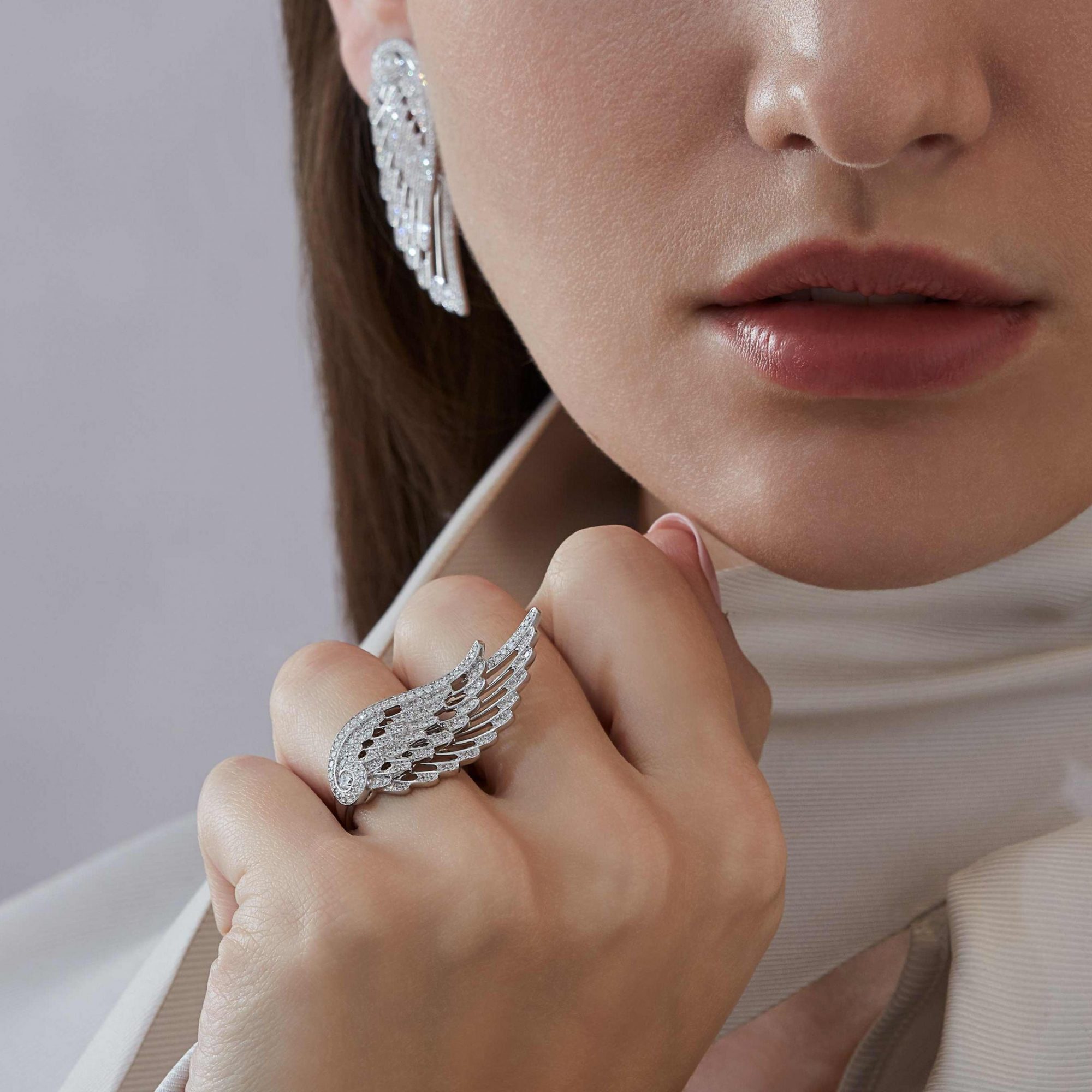 Garrard Wings Embrace jewellery collection Across the Finger Diamond Ring In 18ct White Gold 2016575 and earrings On Model
