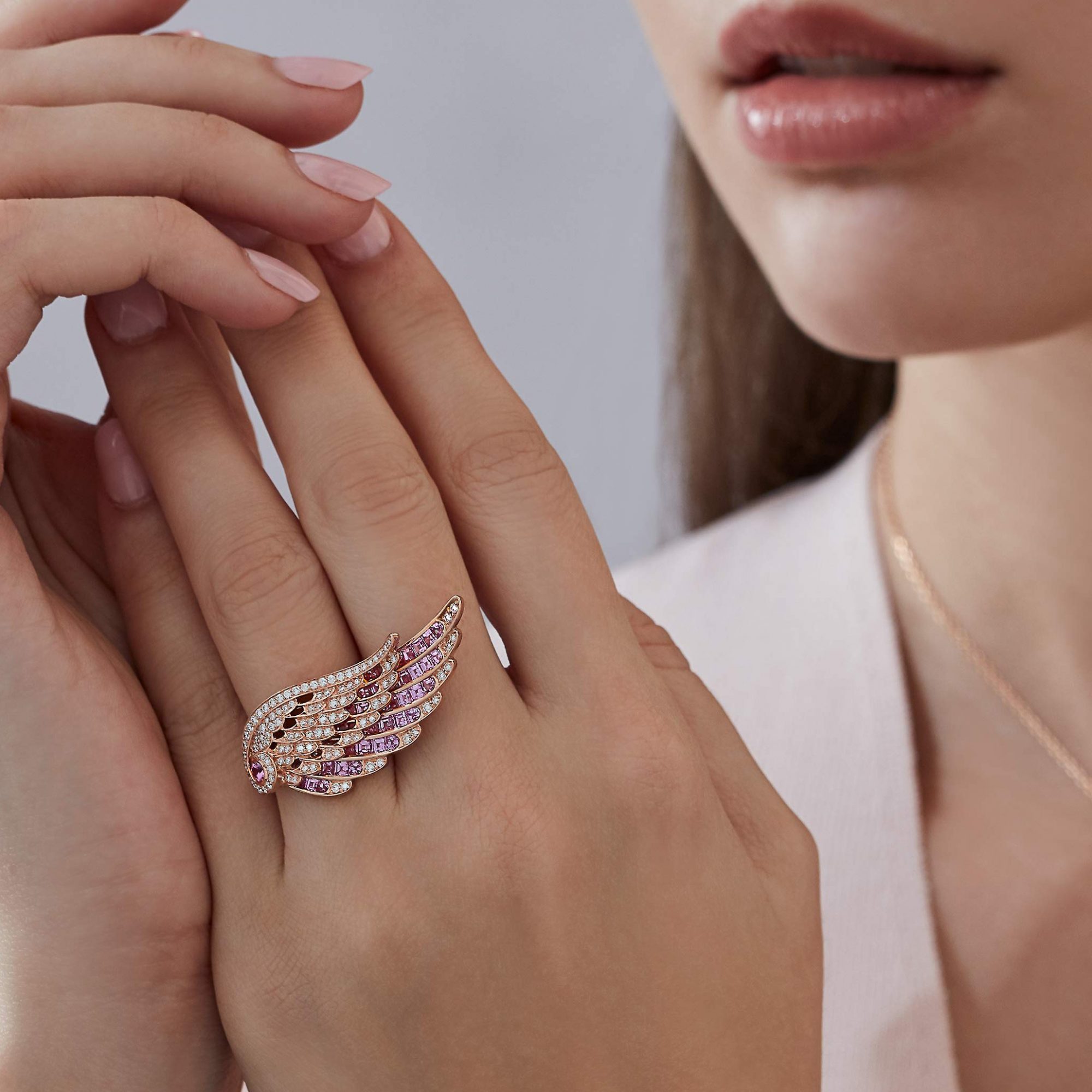 Garrard Wings Embrace jewellery collection Across the Finger Pink Sapphire and Diamond Ring 2016585 pendant and earrings Model