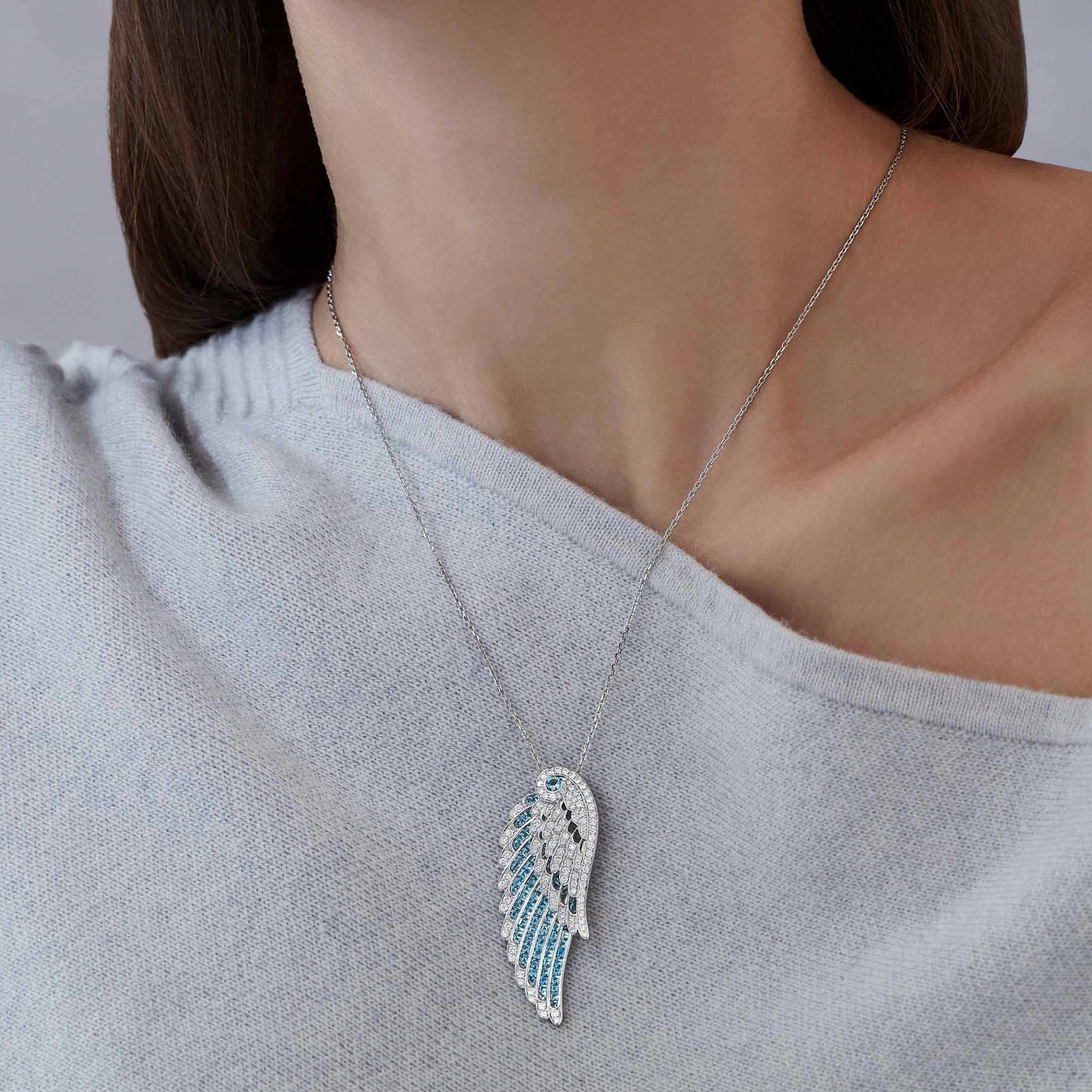 Garrard Wings Embrace jewellery collection Aquamarine and Diamond Slider Pendant In 18ct White Gold 2016642 and earrings On Model Garrard Wings Embrace jewellery collection Aquamarine and Diamond Slider Pendant In 18ct White Gold 2016642 and earrings On Model