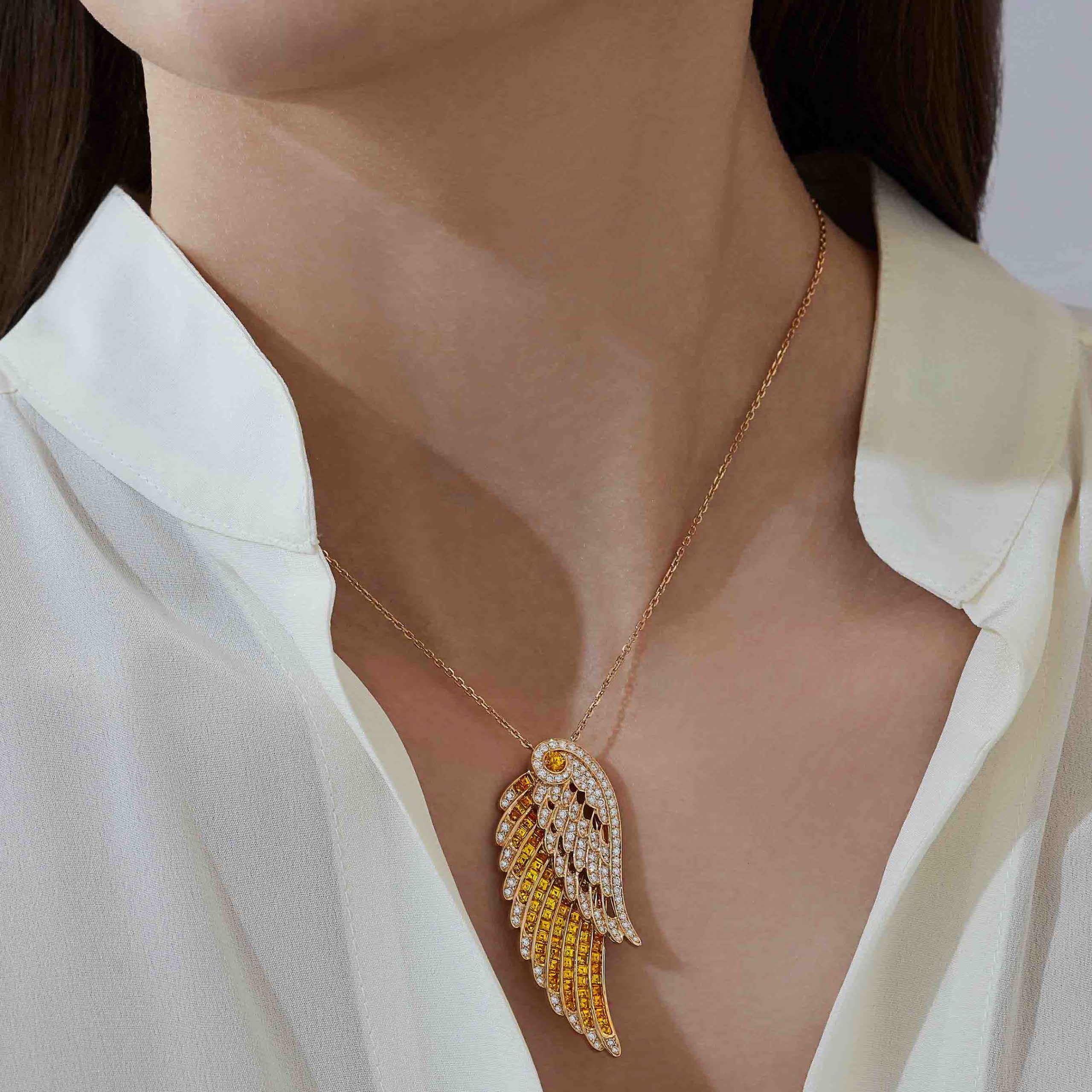Garrard Wings Embrace jewellery collection Yellow Sapphire and Diamond Pendant In 18ct Yellow Gold 2016580 On Model 1 Garrard Wings Embrace jewellery collection Yellow Sapphire and Diamond Pendant In 18ct Yellow Gold 2016580 On Model 1