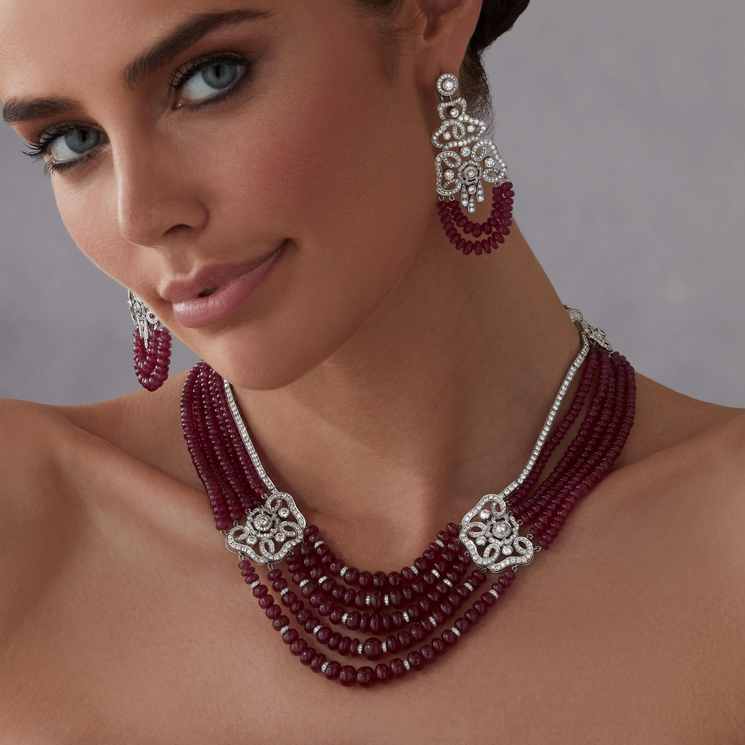 Red Rose High Jewellery Ruby and Diamond Necklace In 18ct White Gold 2015423 and earrings 2015424 on model Red Rose High Jewellery Ruby and Diamond Necklace In 18ct White Gold 2015423 and earrings 2015424 on model