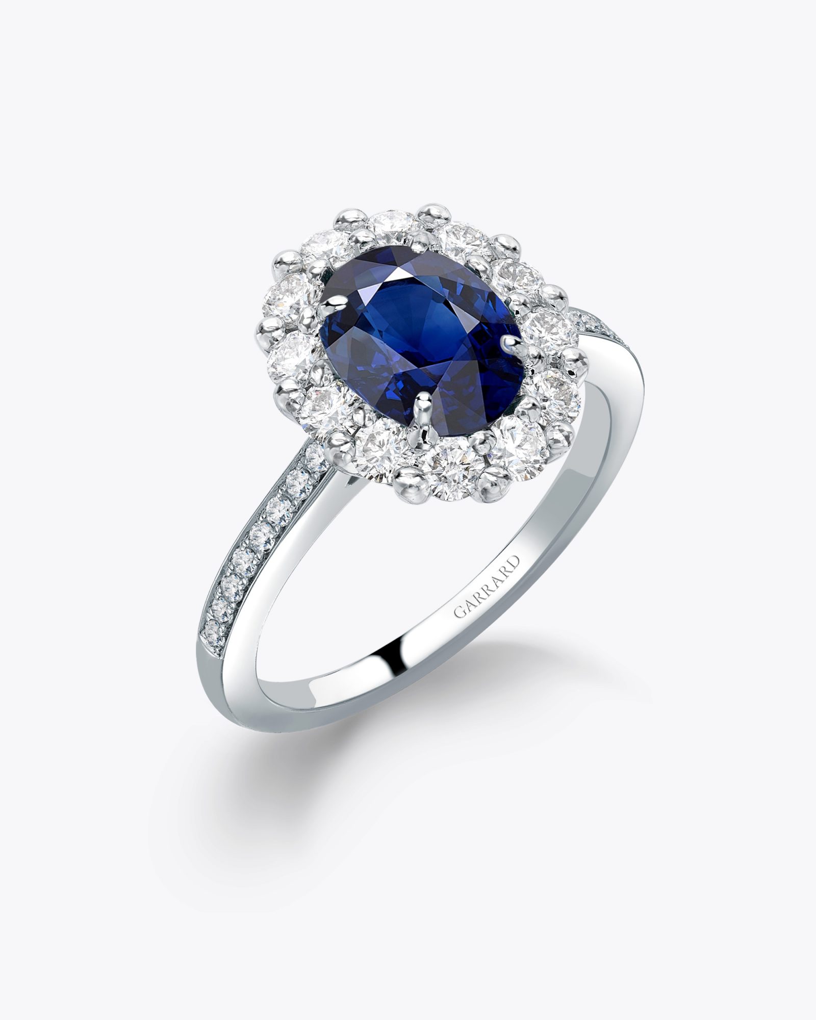 The Garrard 1735 Oval Cut sapphire and Diamond Cluster Engagement Ring 1