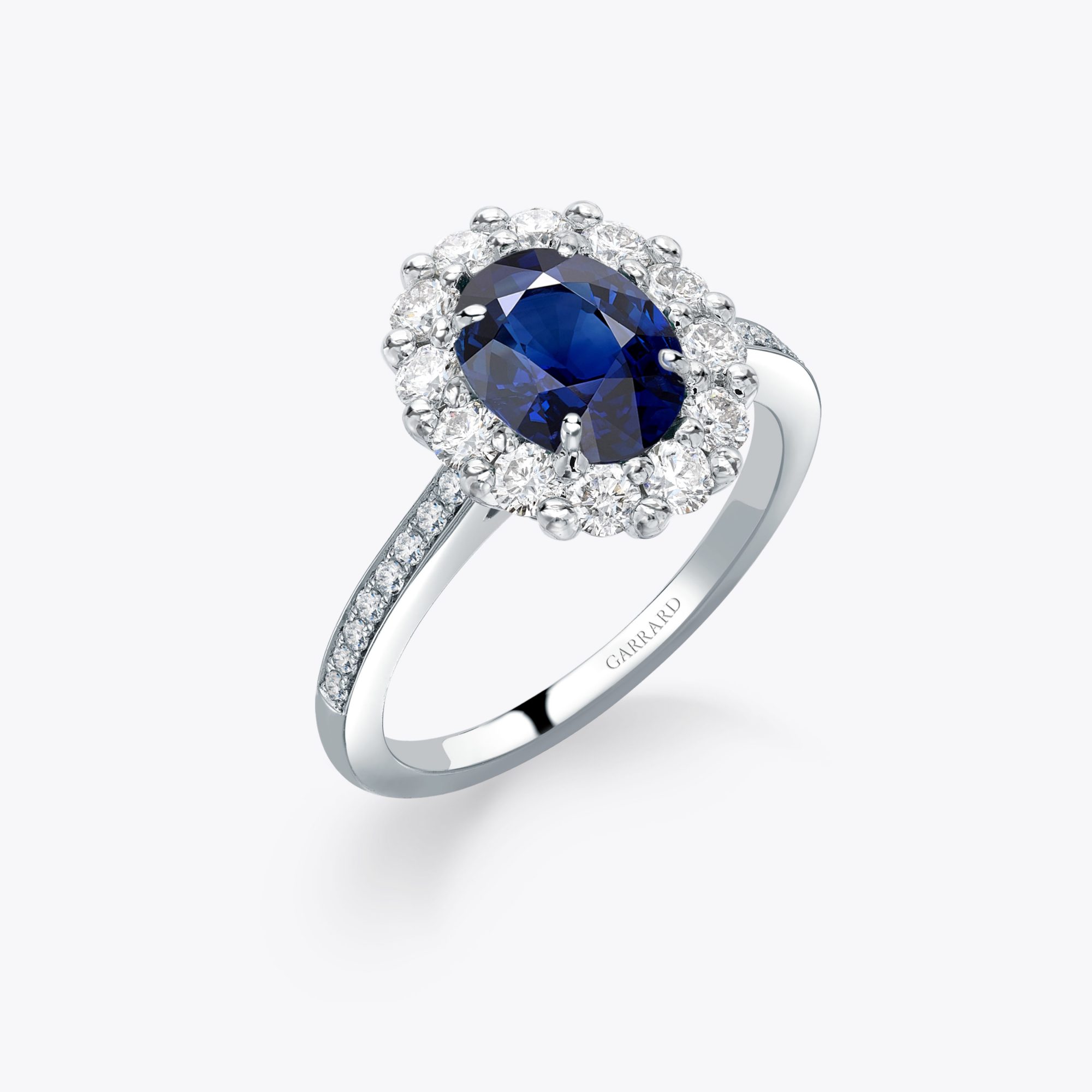 The Garrard 1735 Oval Cut sapphire and Diamond Cluster Engagement Ring 1x1 1