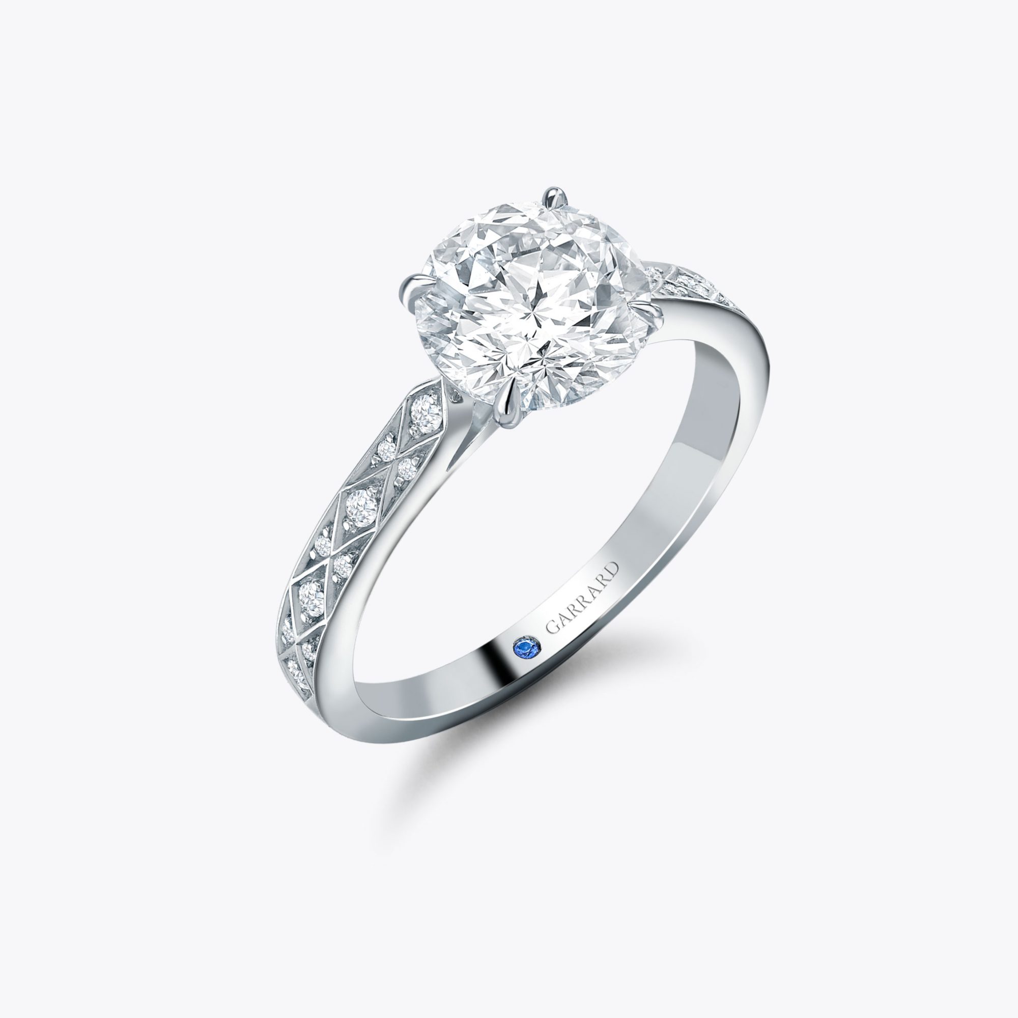 The Garrard Signature Round Diamond Solitaire Engagement Ring In Platinum with Diamonds 1x1 1