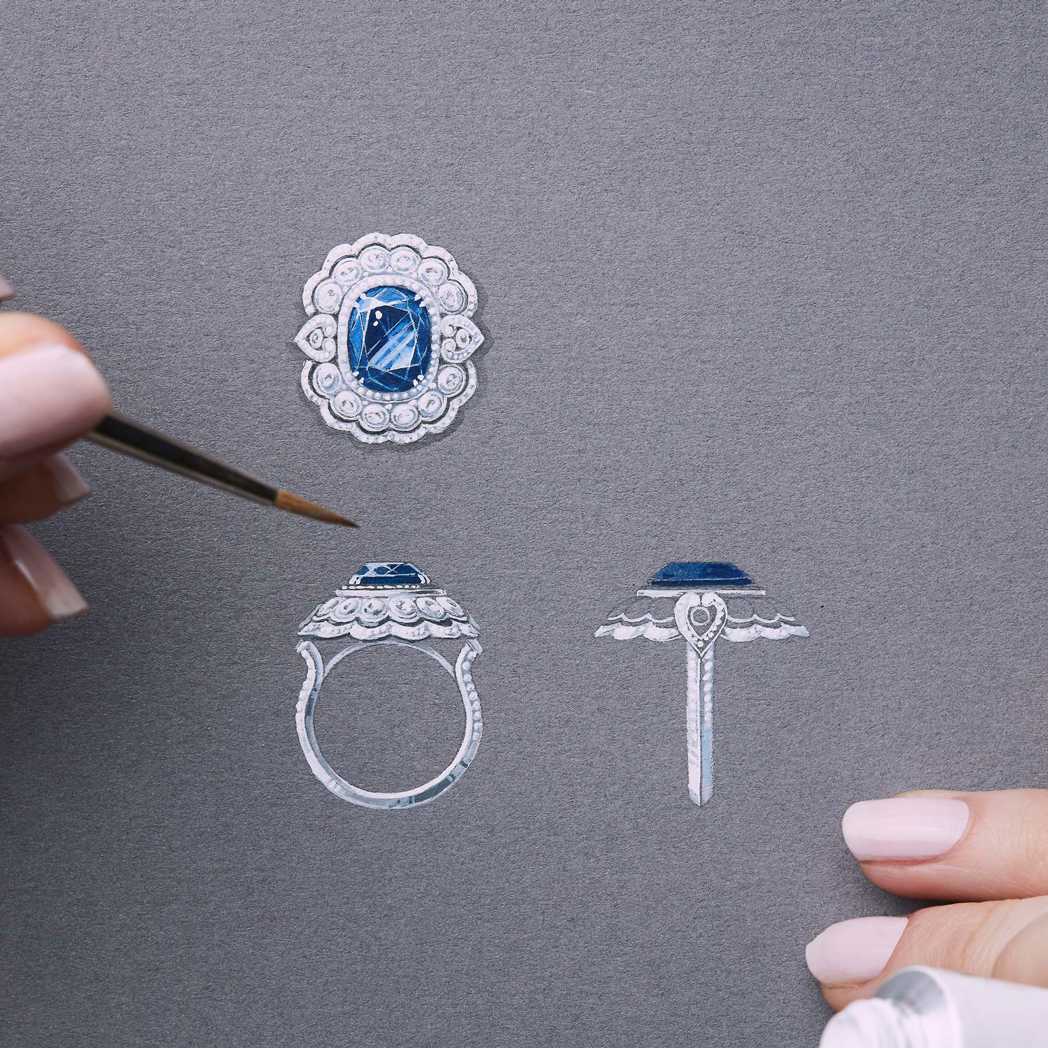 a Garrard jewellery designer skethcing a bespoke sapphire Garrard engagement ring on gouache paper square 2