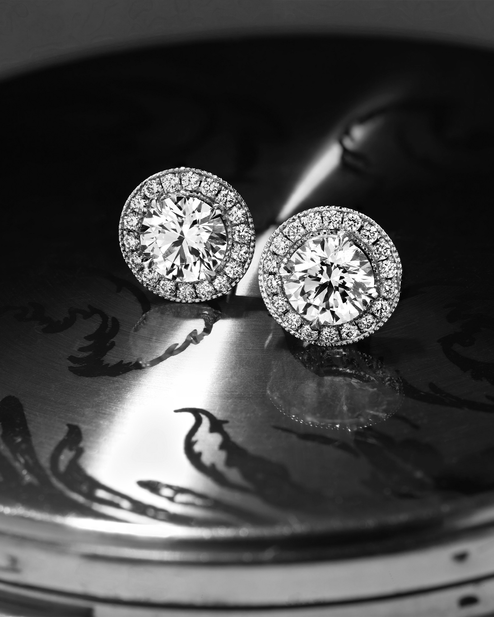 Close up of a pair of Garrard Classic jewellery collection Diamond earrings landing
