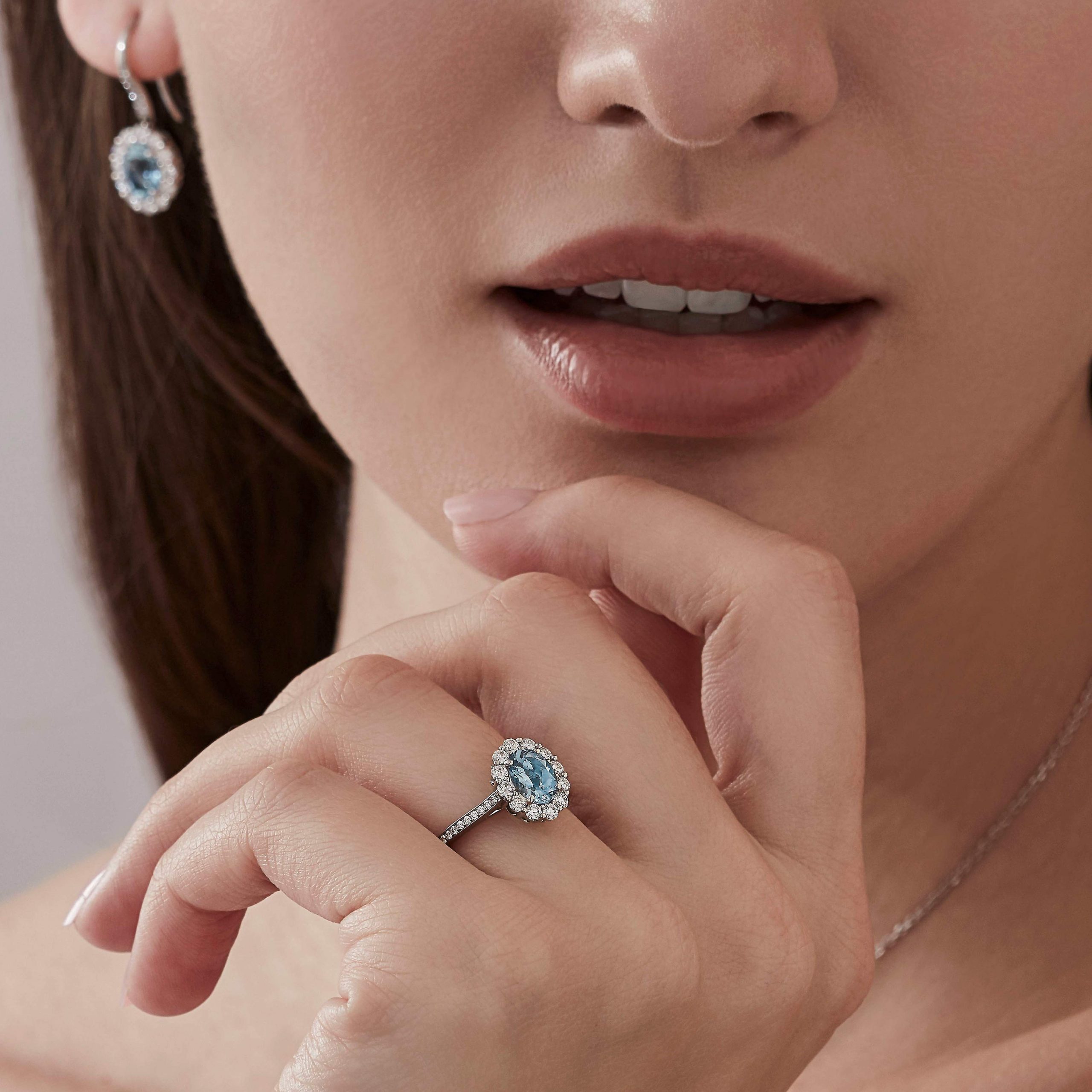 Garrard 1735 collection jewellery Aquamarine Oval Ring In Platinum with Diamonds JR17PT10 and earrings On Model 1 Garrard 1735 collection jewellery Aquamarine Oval Ring In Platinum with Diamonds JR17PT10 and earrings On Model 1