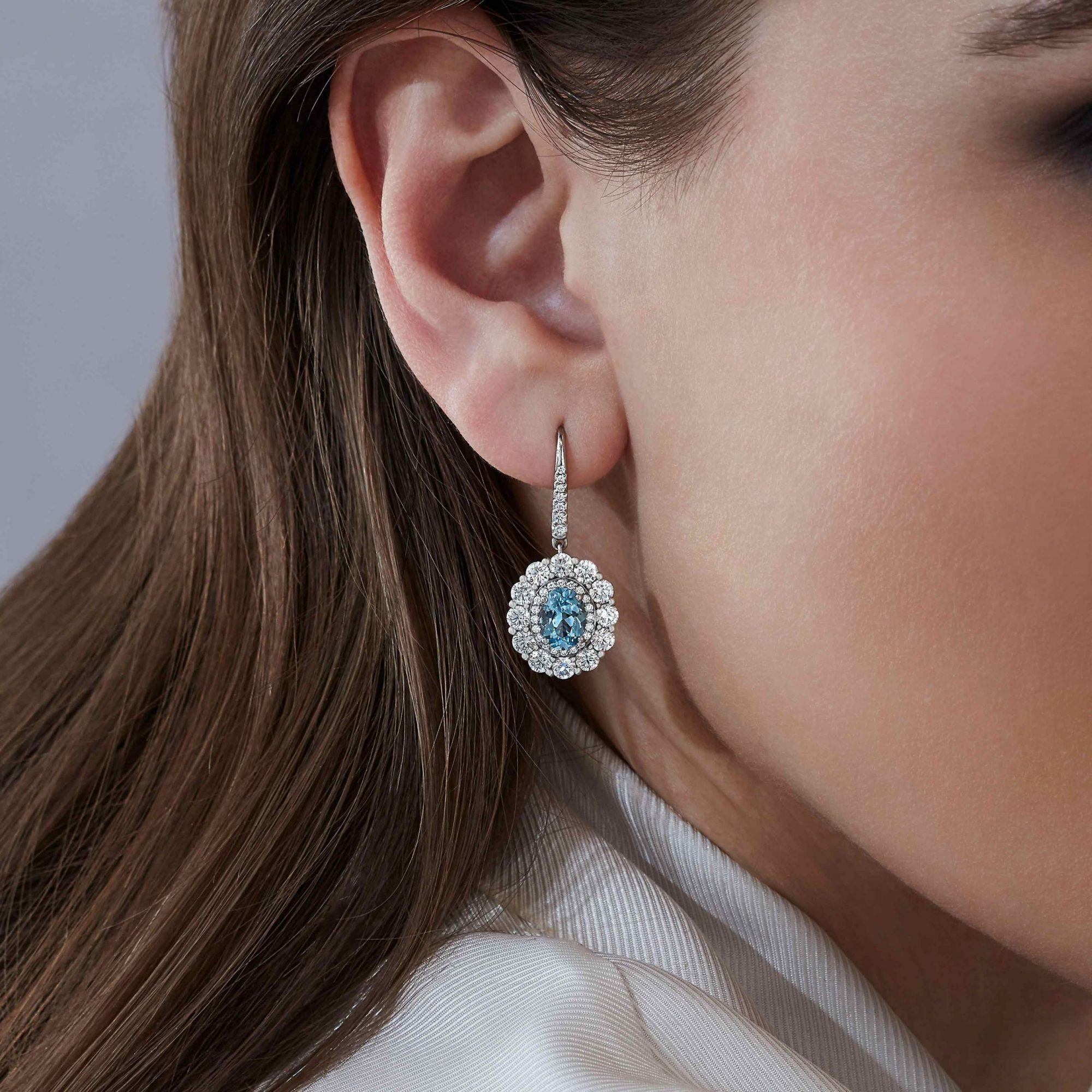 Garrard 1735 jewellery collection Aquamarine Double Cluster Earrings in platinum with Diamonds JE17PT17 On Model