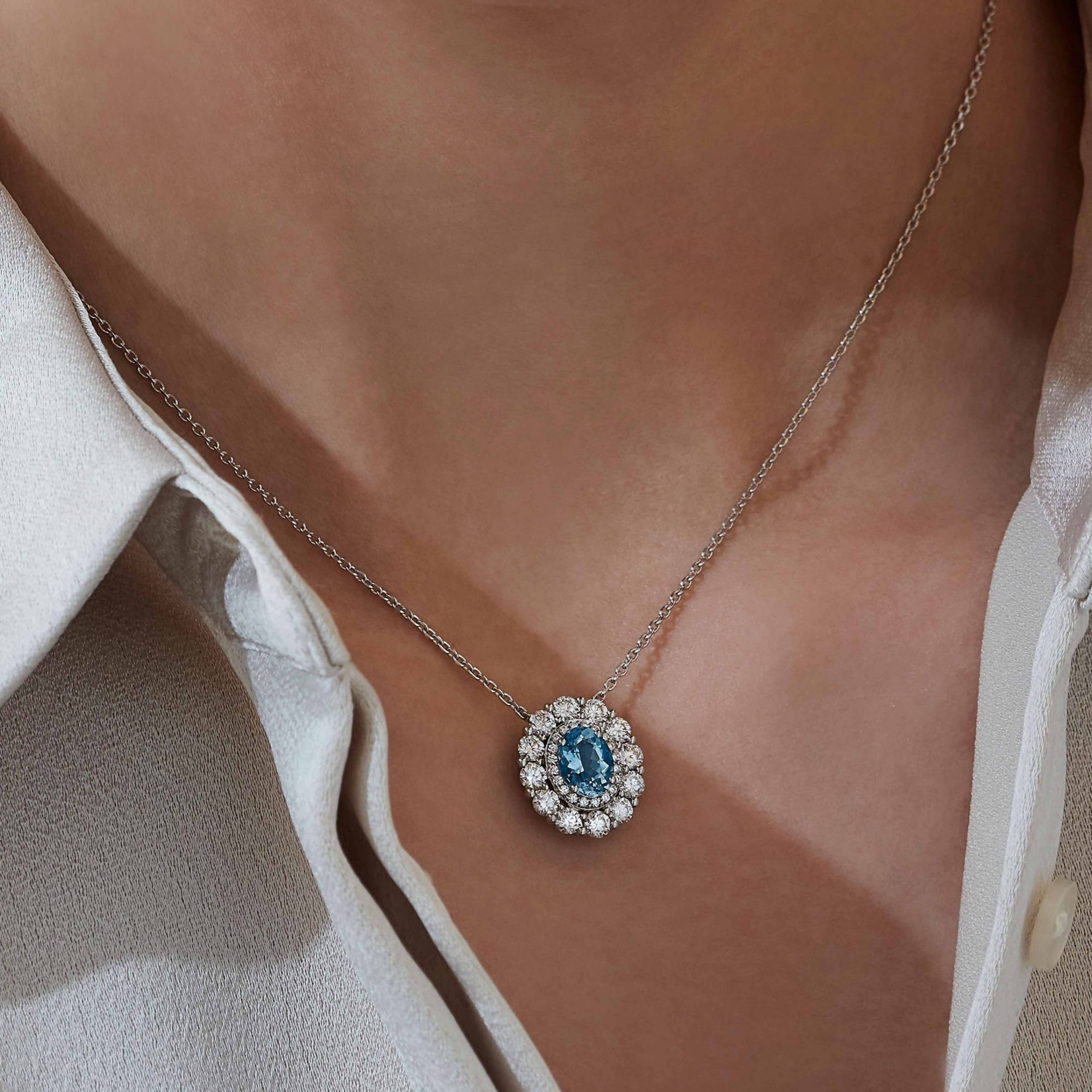 Garrard 1735 jewellery collection Aquamarine Double Cluster Pendant in Platinum with DiamondsJP17PT11 On Model