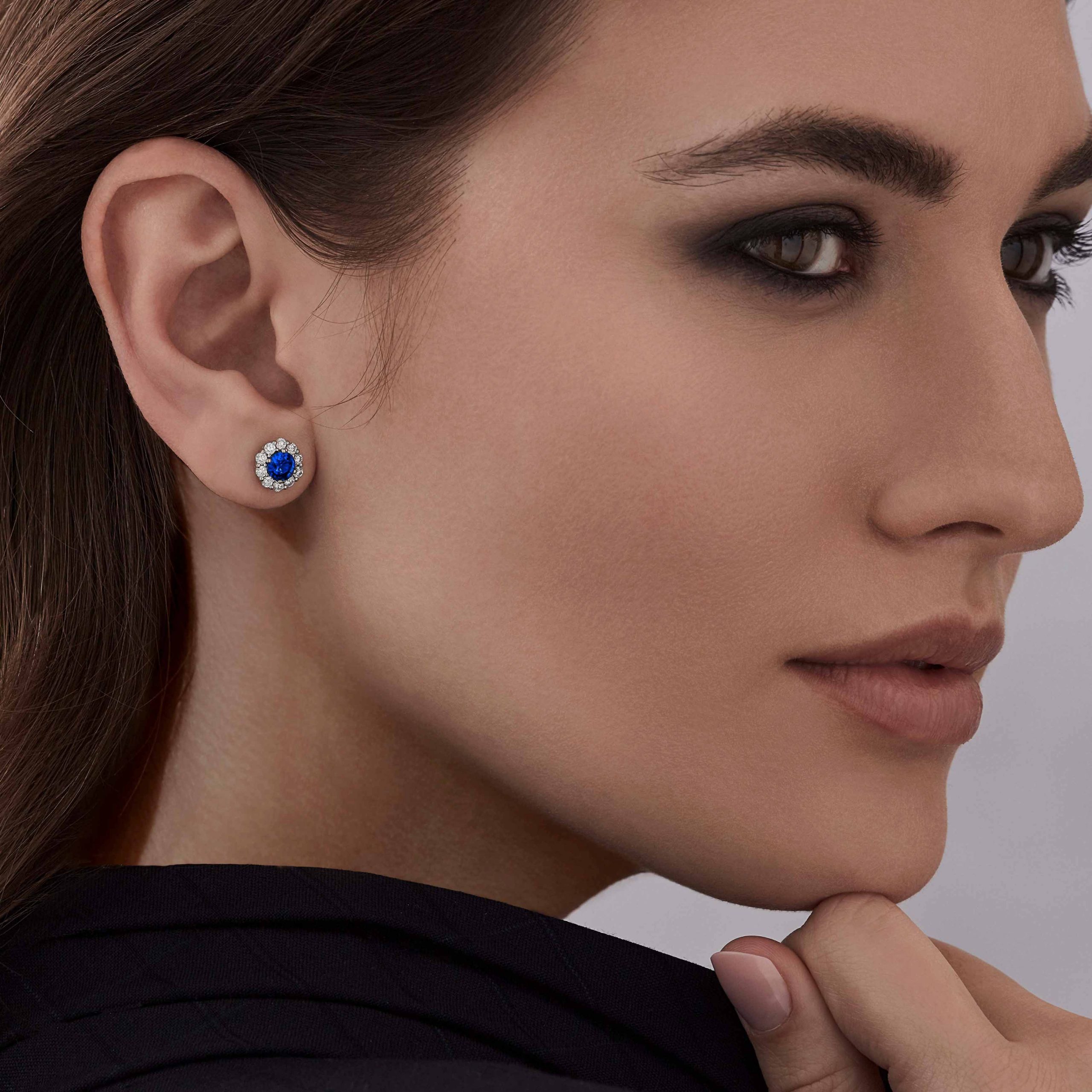 Garrard 1735 jewellery collection sapphire round stud earrings in platinum with diamonds JE17PT06 On Model Garrard 1735 jewellery collection sapphire round stud earrings in platinum with diamonds JE17PT06 On Model