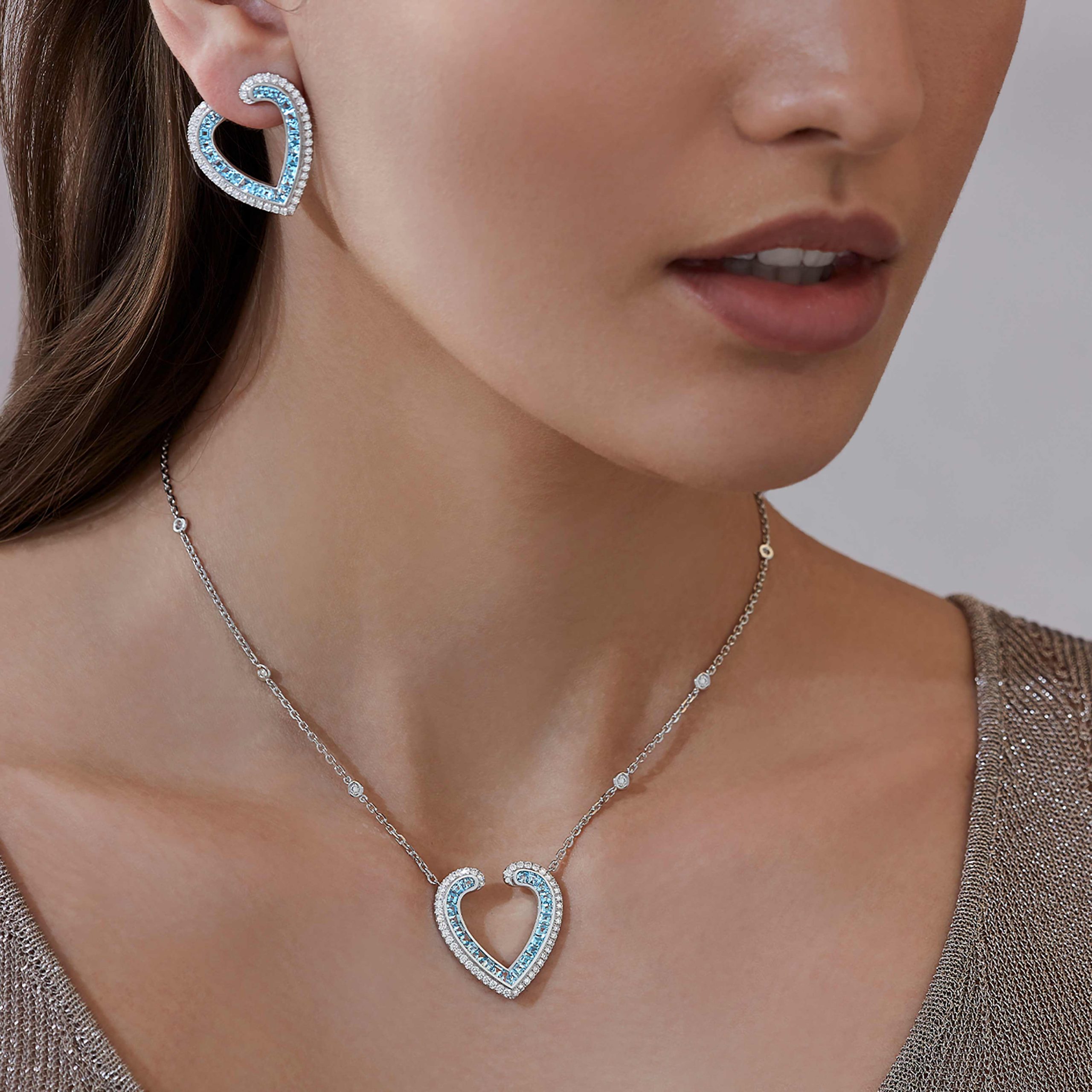 Garrard Aloria jewellery Collection calibre cut aquamarine pendant in 18ct white gold with Diamonds 2017066 and earrings On Model Garrard Aloria jewellery Collection calibre cut aquamarine pendant in 18ct white gold with Diamonds 2017066 and earrings On Model