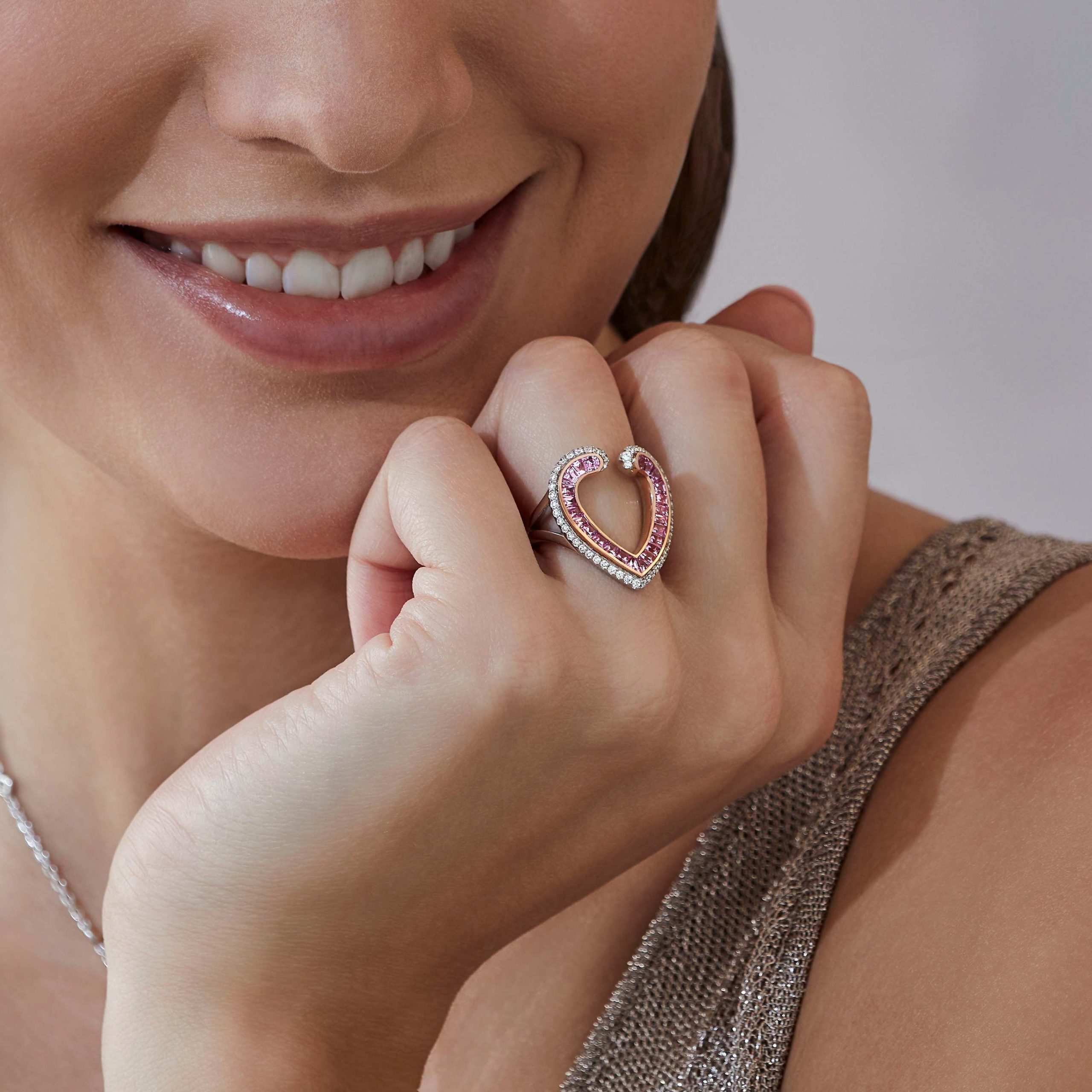 Garrard Aloria jewellery collection Calibre cut pink sapphire ring in 18ct rose gold with diamonds 2017069 On Model Garrard Aloria jewellery collection Calibre cut pink sapphire ring in 18ct rose gold with diamonds 2017069 On Model