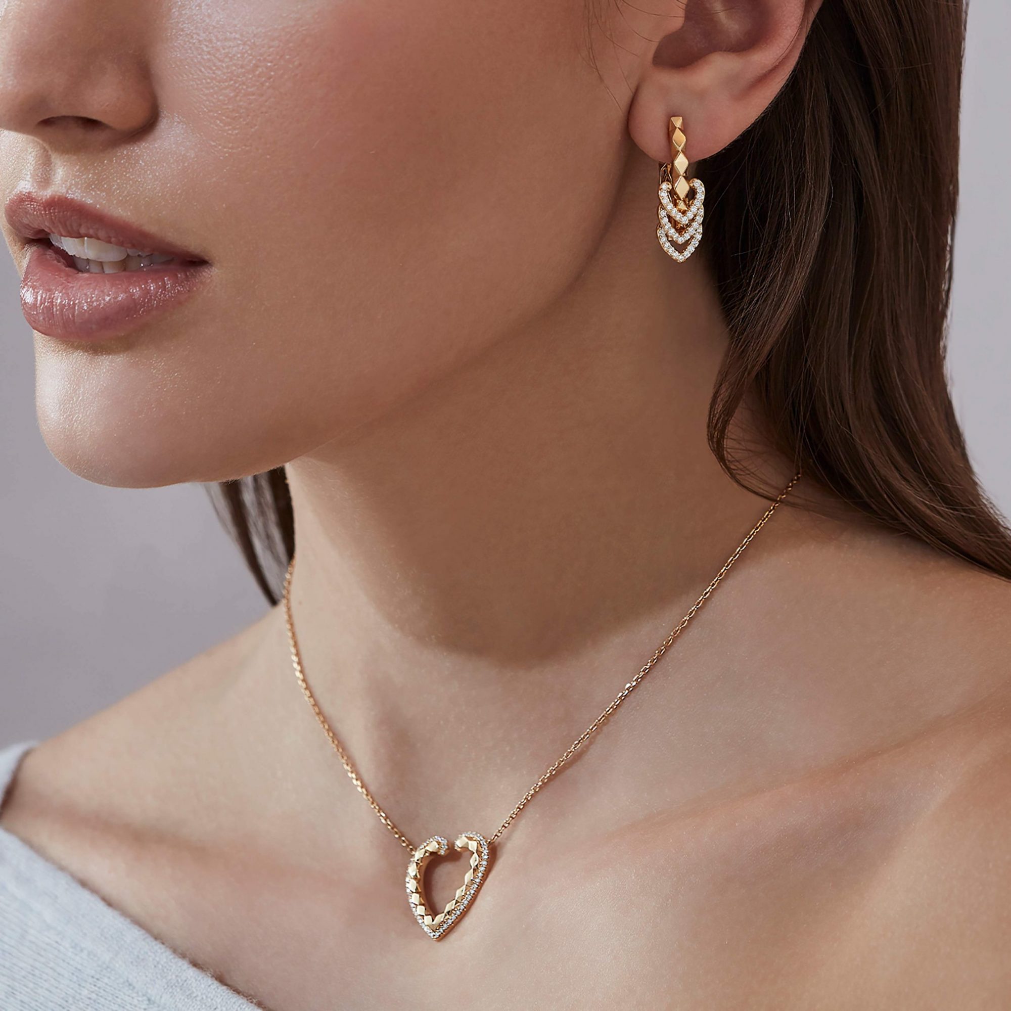 Garrard Aloria jewellery collection Reversible Hoop Earrings with Diamonds and Enamel 2016937 and pendant 2016932 On Model
