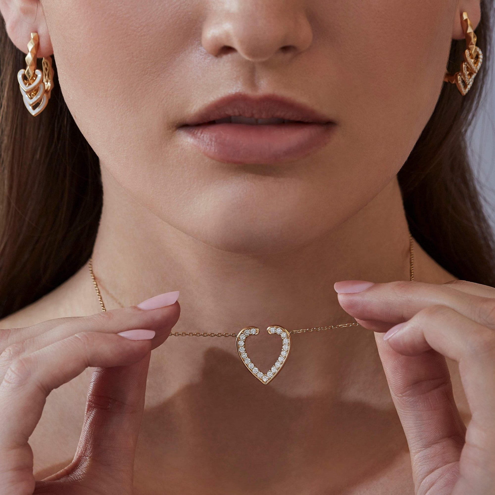 Garrard Aloria jewellery collection Reversible Pendant In 18ct Yellow Gold Diamonds and Enamel 2016934 and earrings On Model