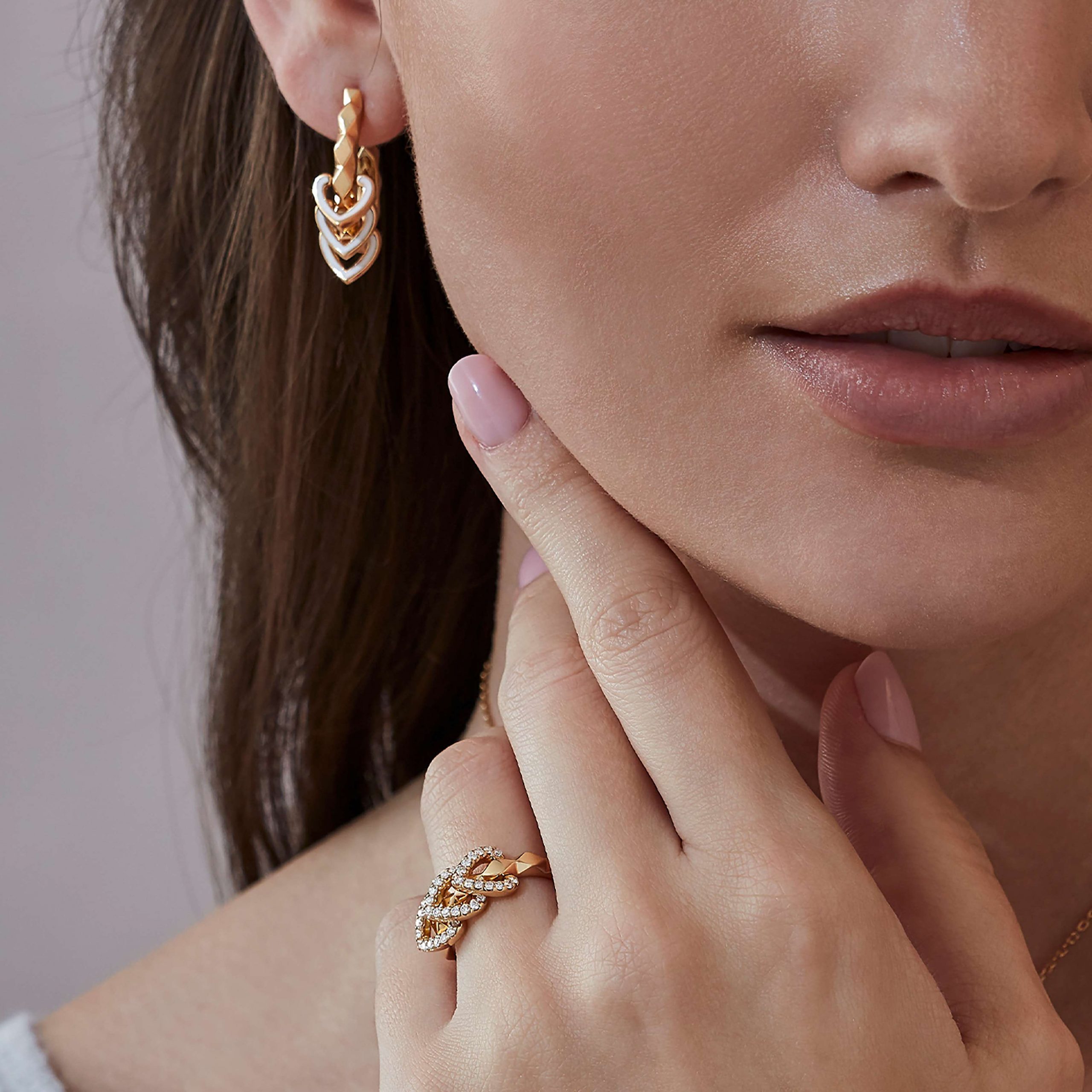 Garrard Aloria jewellery collection Reversible Ring In 18ct Yellow Gold with Diamonds and Enamel 2017048 and earrings 2016937 On Model Garrard Aloria jewellery collection Reversible Ring In 18ct Yellow Gold with Diamonds and Enamel 2017048 and earrings 2016937 On Model