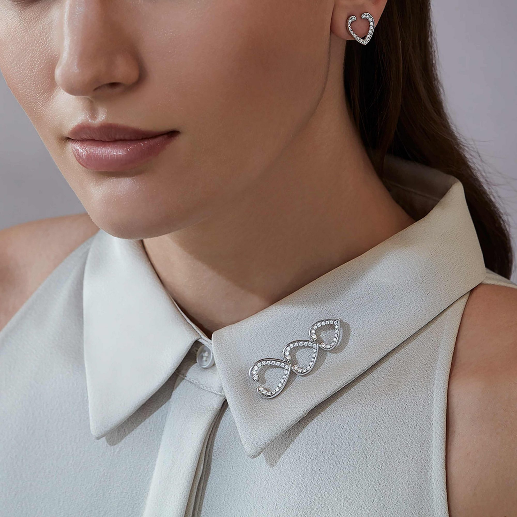Garrard Aloria jewellery collection Transformable Diamond Hairclip Brooch In 18ct White Gold 2016930 and earrings 2016926 On Model