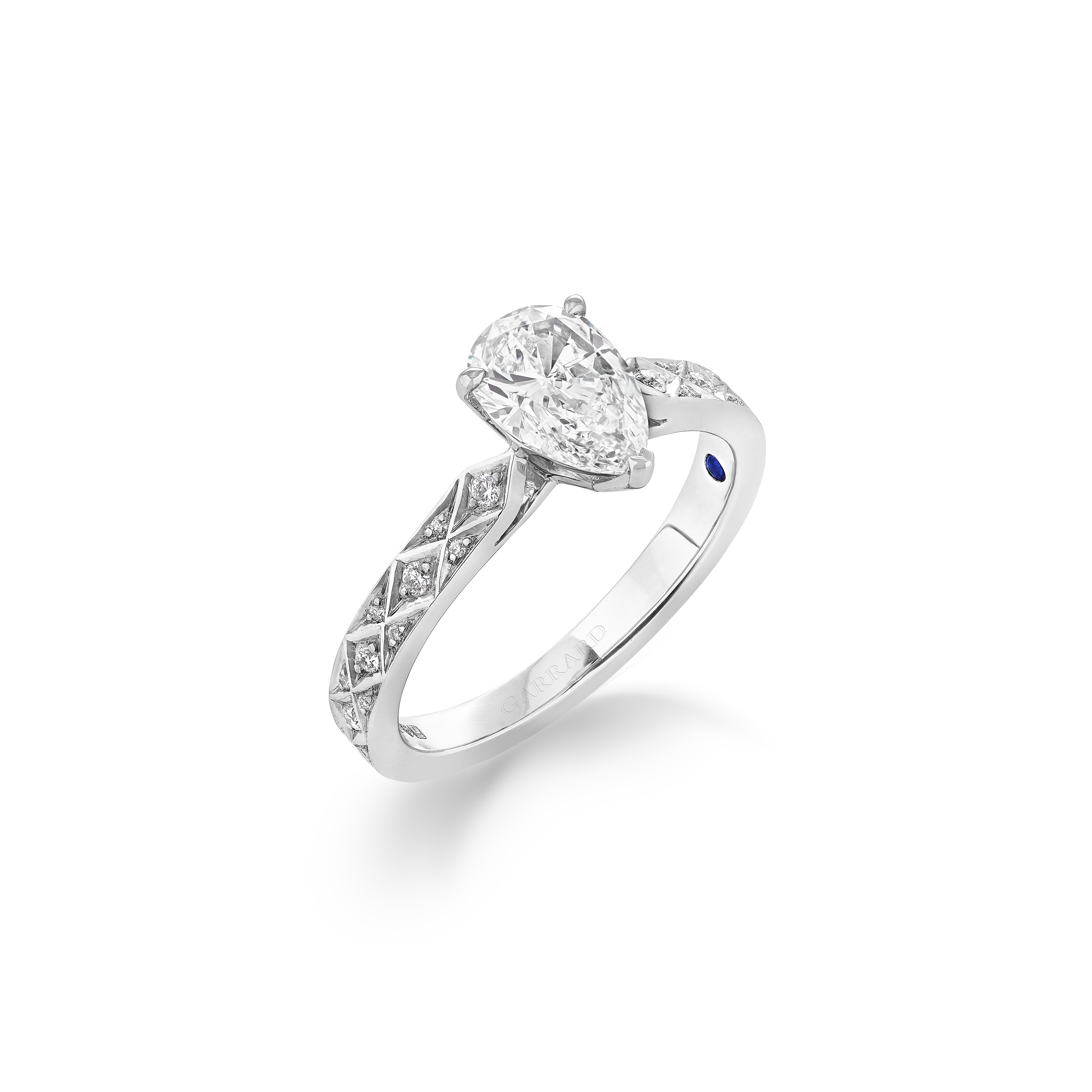 Garrard Bridal collection Signature Pear Shape Diamond Solitaire Engagement Ring In Platinum with Diamonds JRSGPT01 2017577 HERO 1 Garrard Bridal collection Signature Pear Shape Diamond Solitaire Engagement Ring In Platinum with Diamonds JRSGPT01 2017577 HERO 1