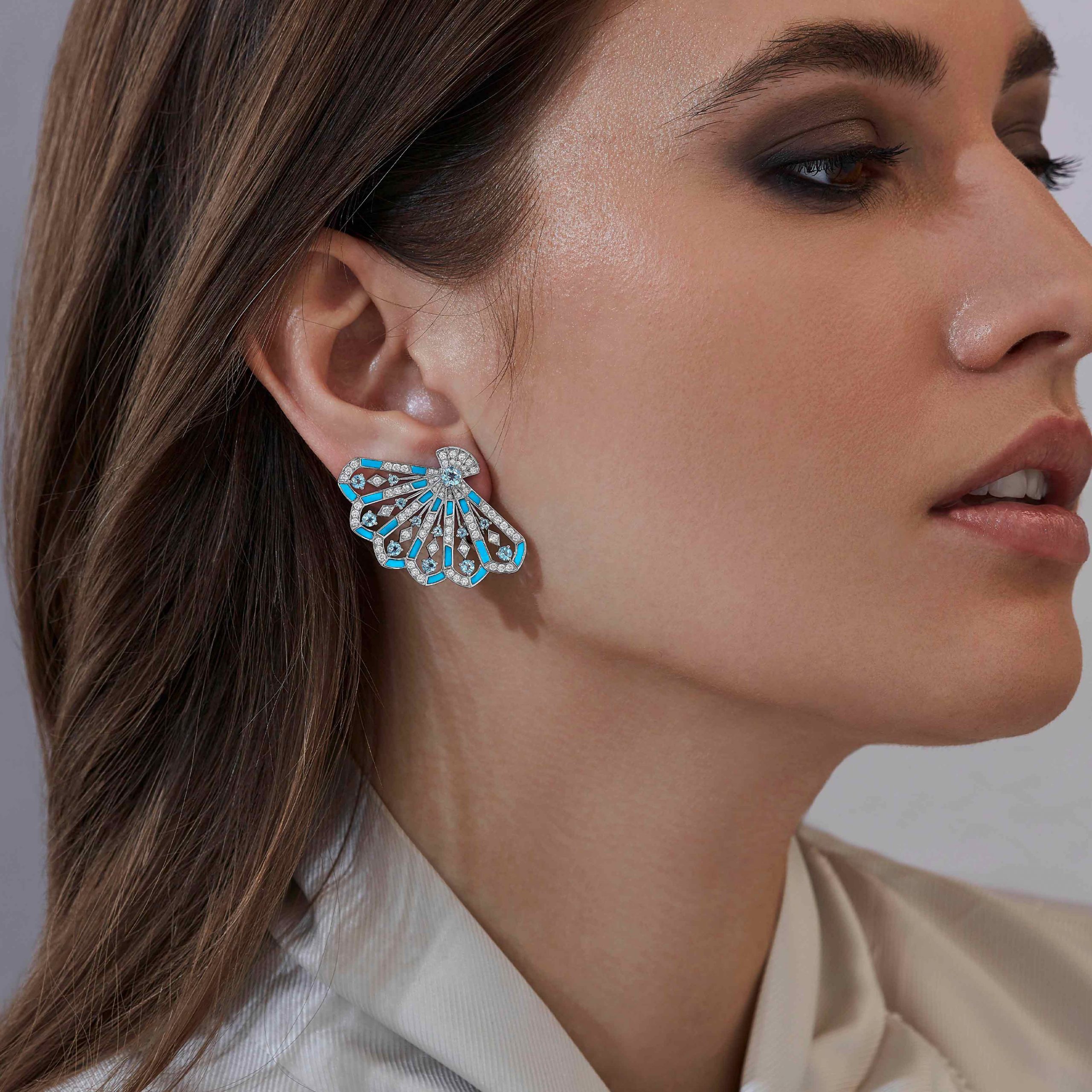Garrard Fanfare Symphony jewellery collection Diamond and Aquamarine Earrings In 18ct White Gold with Turquoise 2017308 On Model Garrard Fanfare Symphony jewellery collection Diamond and Aquamarine Earrings In 18ct White Gold with Turquoise 2017308 On Model