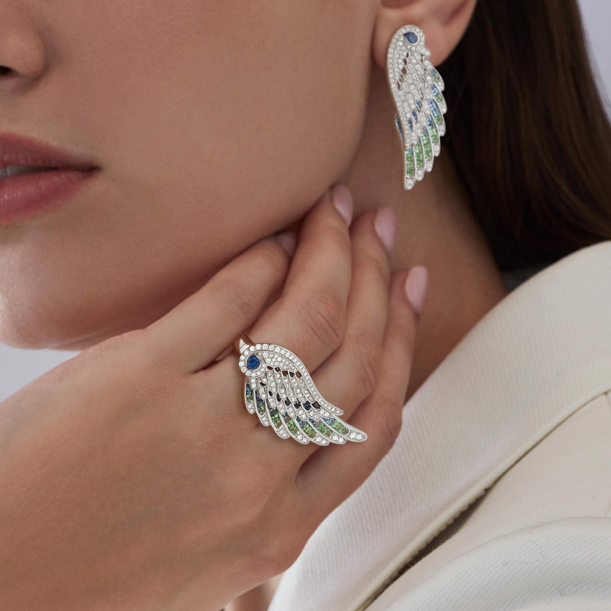 Garrard WIngs Embrace collection Peacock ring with diamonds Sapphires Tsavorites and Aquamarines and earrings 2017612 On Model 1