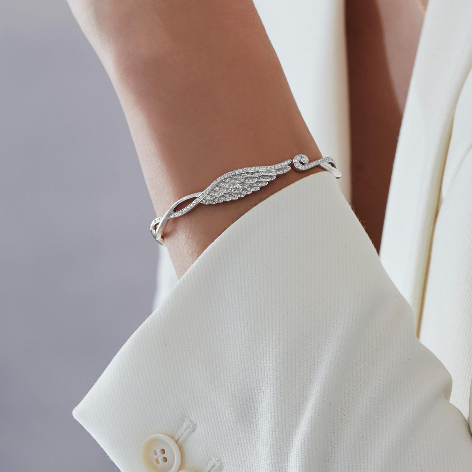 Garrard Wings Embrace jewellery collection Diamond bangle in 18ct white gold 2015922 2015754 2015923 On Model