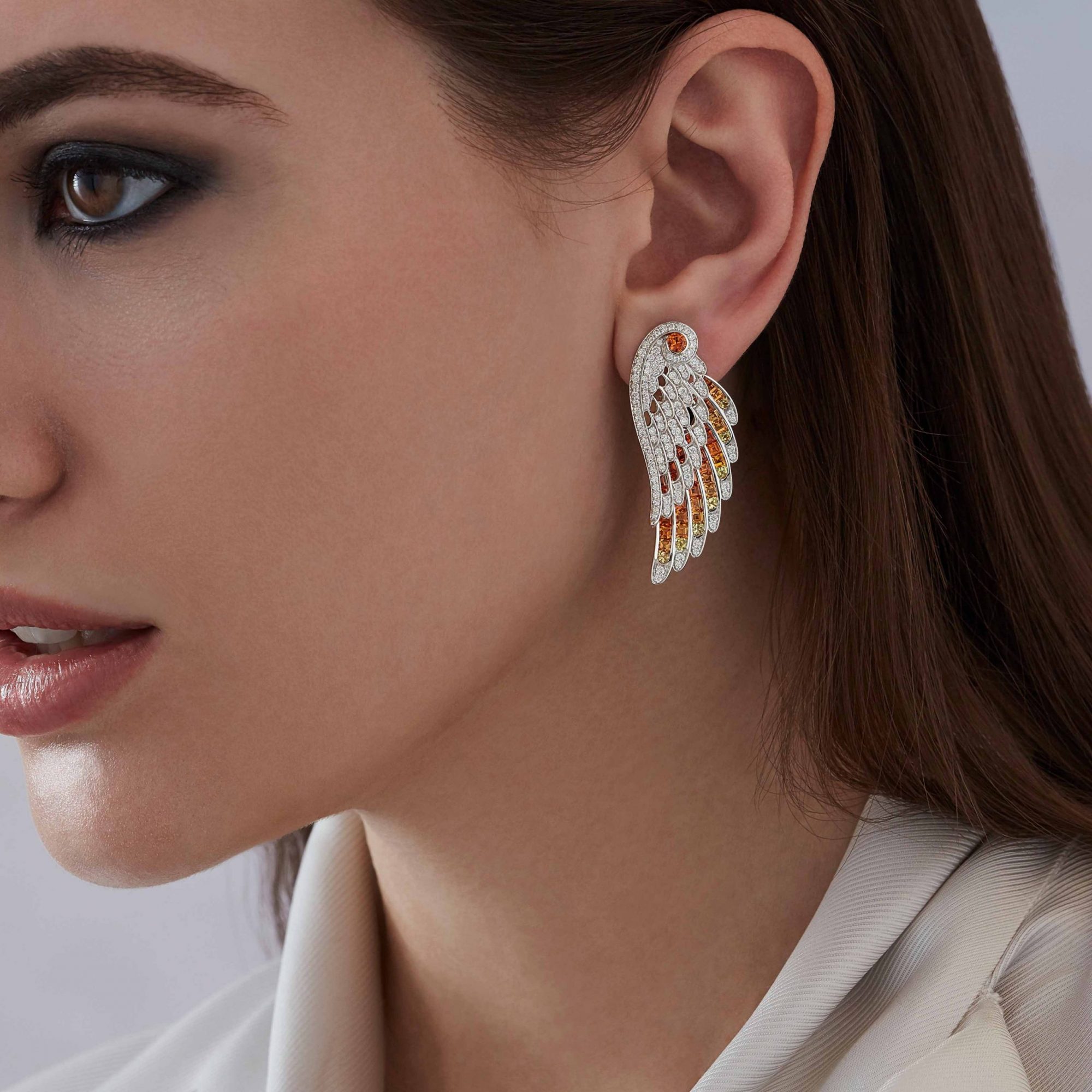 Garrard Wings Embrace jewellery collection Phoenix Ear Jacket In 18ct White Gold with Diamonds and Sapphires 2017608 Model 1