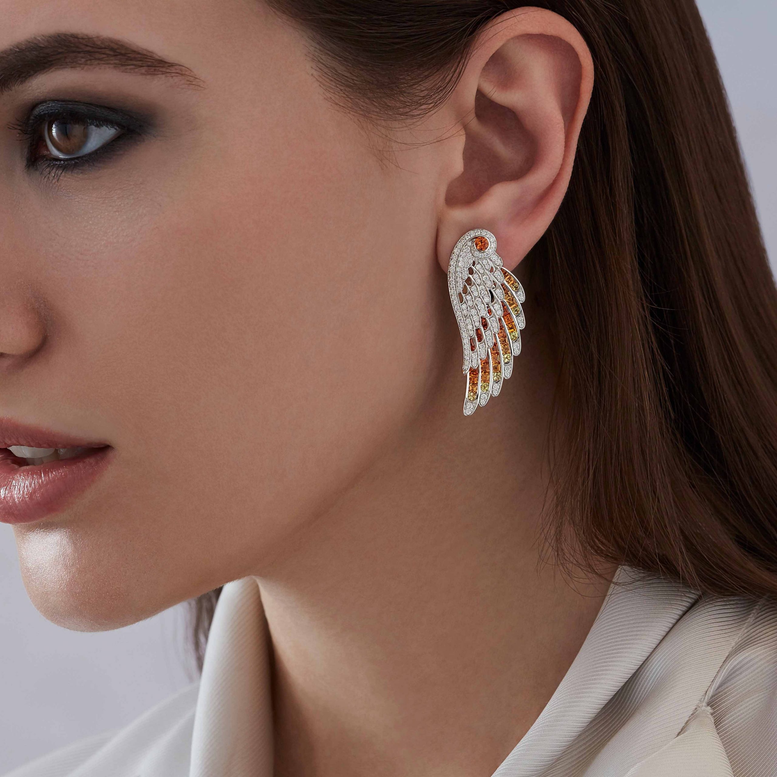 Garrard Wings Embrace jewellery collection Phoenix Ear Jacket In 18ct White Gold with Diamonds and Sapphires 2017608 Model 1 Garrard Wings Embrace jewellery collection Phoenix Ear Jacket In 18ct White Gold with Diamonds and Sapphires 2017608 Model 1