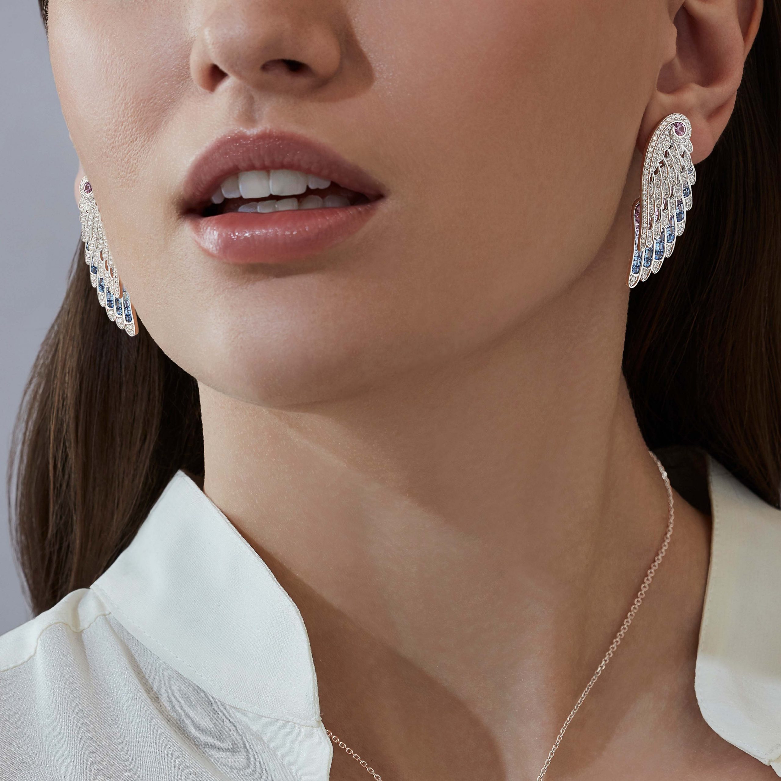 Garrard Wings collection Embrace Bird of Paradise Ear Jackets in 18ct White Gold with Diamonds and Sapphires 2017914 On Model Garrard Wings collection Embrace Bird of Paradise Ear Jackets in 18ct White Gold with Diamonds and Sapphires 2017914 On Model
