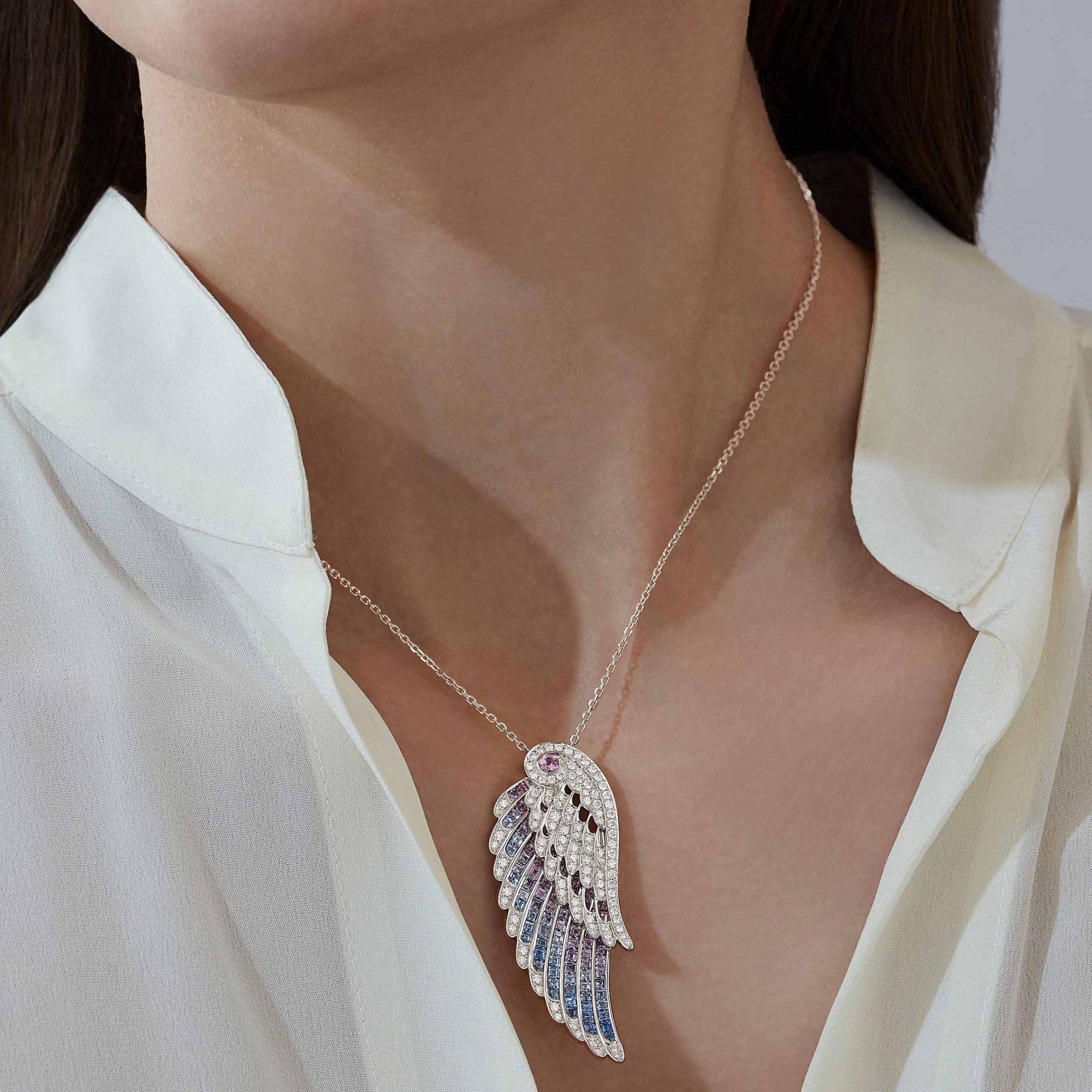Garrard Wings collection Embrace Bird of Paradise Slider Pendant In 18ct White Gold with Diamonds and Sapphires 2017913 Model 1 Garrard Wings collection Embrace Bird of Paradise Slider Pendant In 18ct White Gold with Diamonds and Sapphires 2017913 Model 1