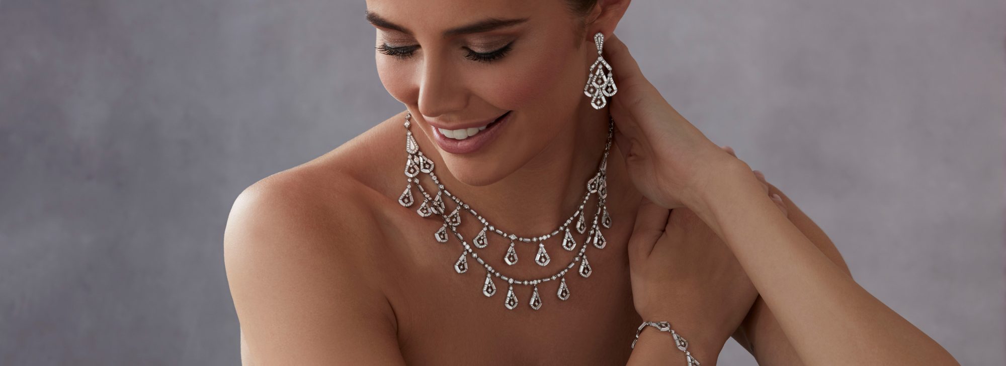 Model wears Garrard high jewellery collection Fanfare Symphony High Jewellery Suite desktop