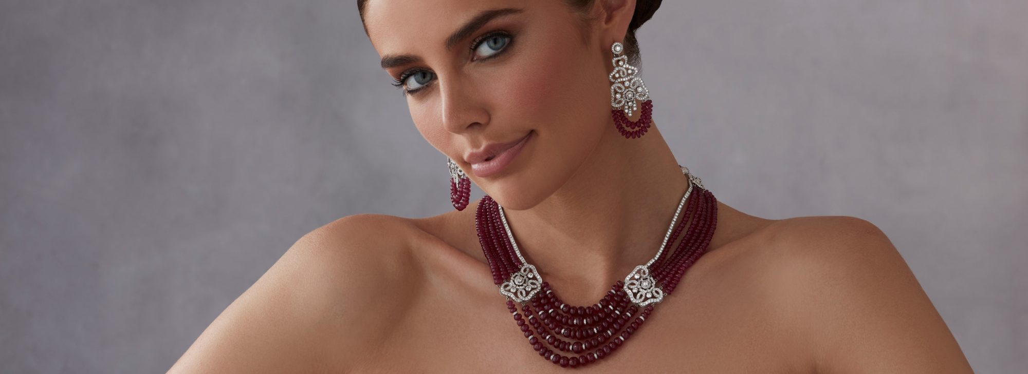 Model wears Garrard high jewellery collection Red Rose High Jewellery Suite desktop