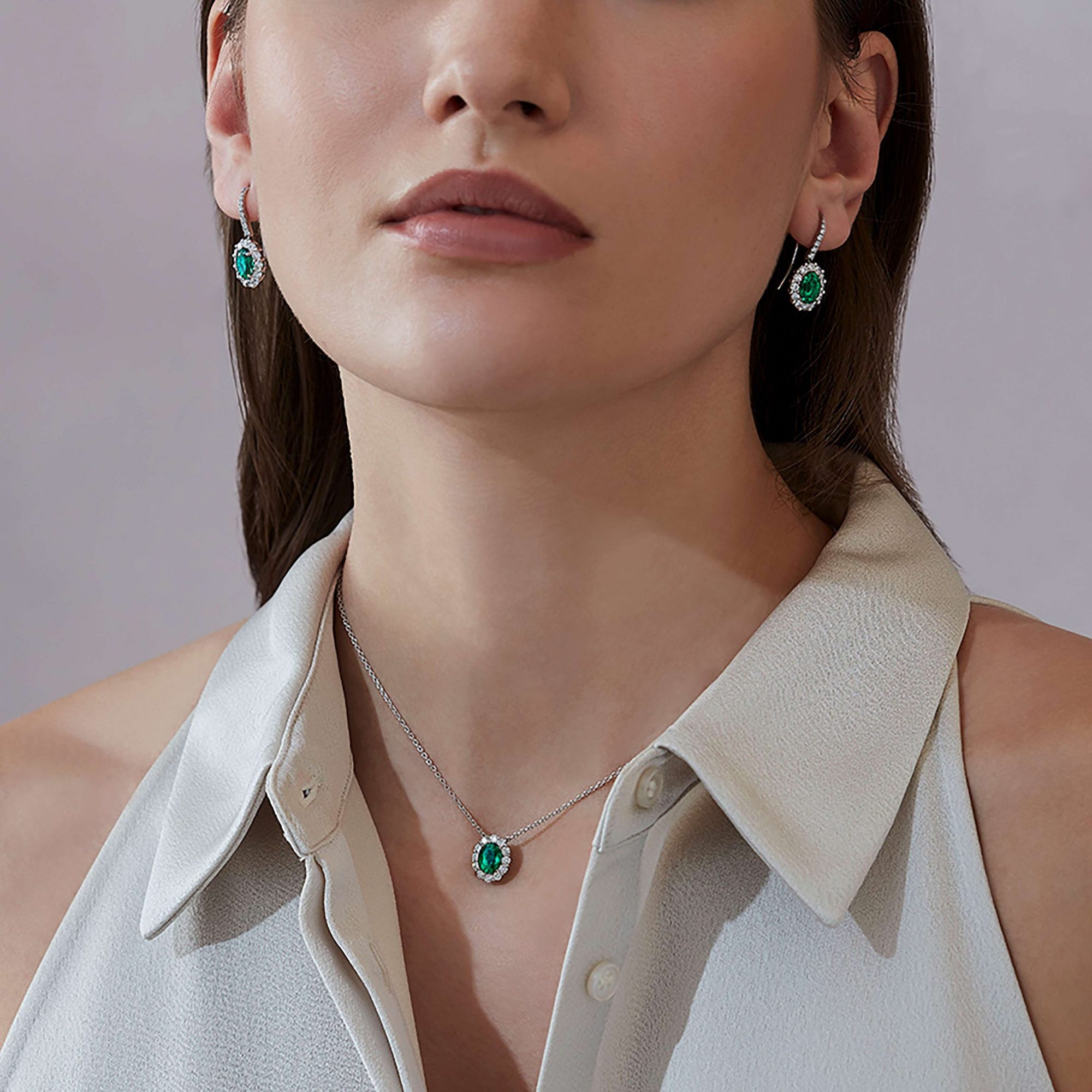 Garrard 1735 jewellery Collection Emerald Oval Pendant in Platinum with Diamonds and earrings JP17PT01 On Model scaled 1