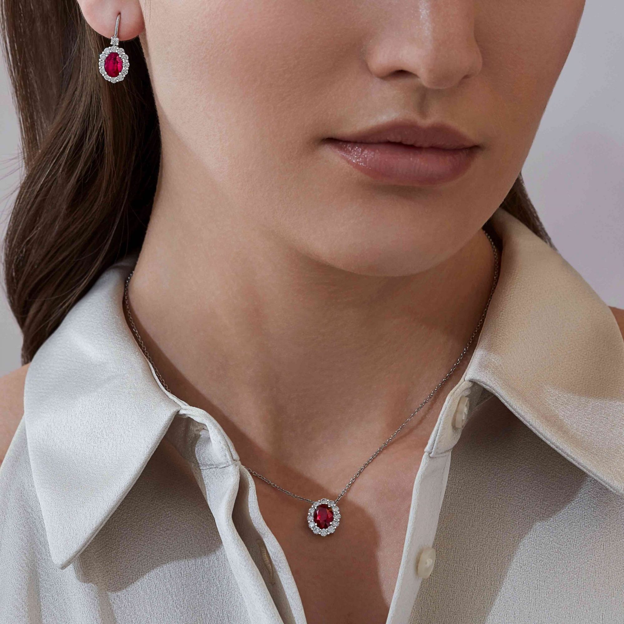 Garrard 1735 jewellery collection Ruby Oval Pendant in Platinum with Diamonds JP17PT0 and earrings On Model scaled 1